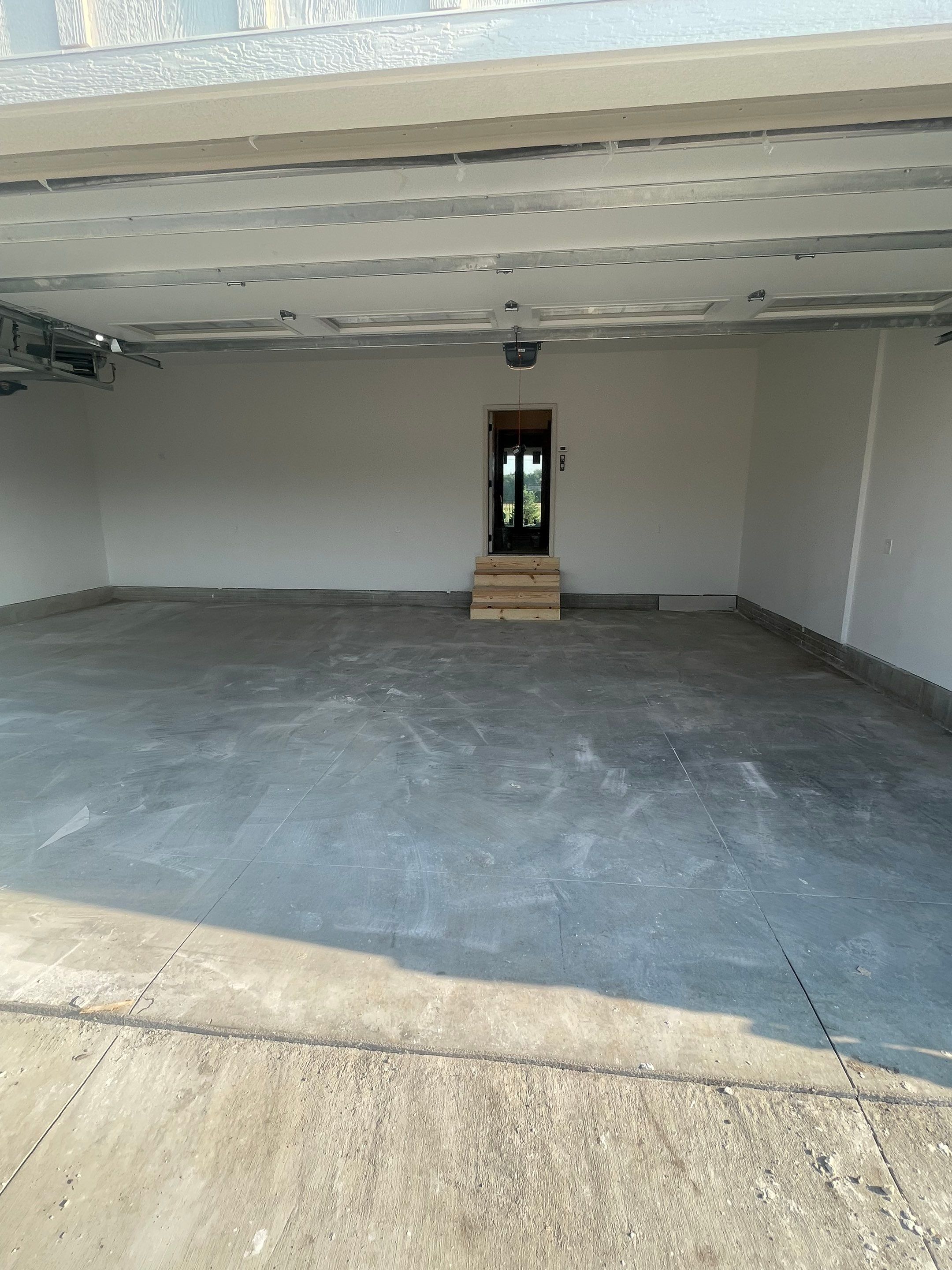 Grey Speckled Garage Floor Coating in Sioux Falls by Select Painting, Coatings & Garage Cabinets
