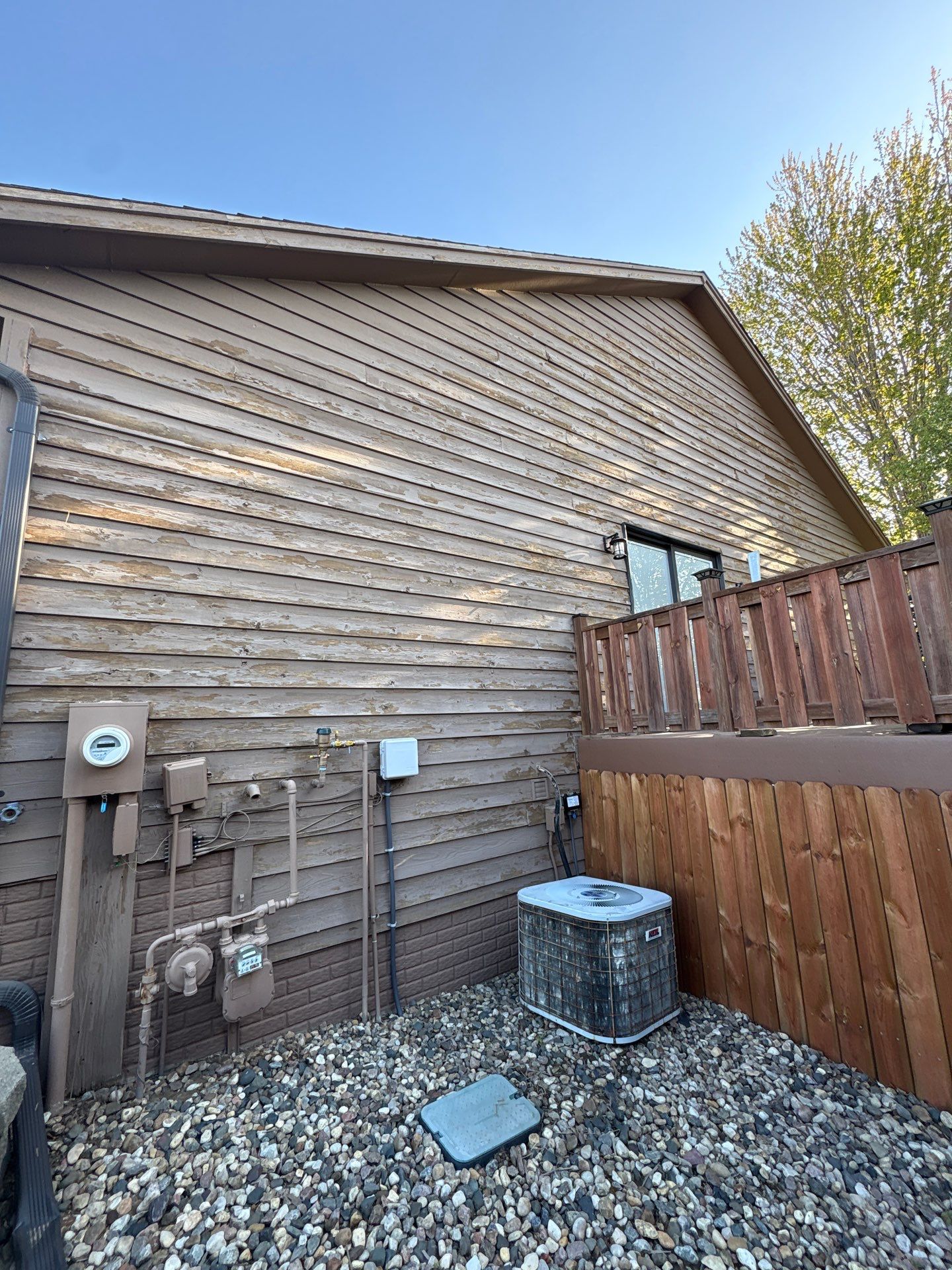 Wood Siding Restoration and Exterior Painting in Sioux Falls by Select Painting, Coatings & Garage Cabinets