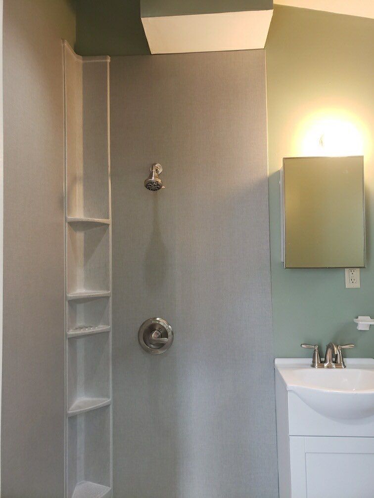 Bathroom Remodel using BCI Acrylic Shower System by Secure Construction Company Inc