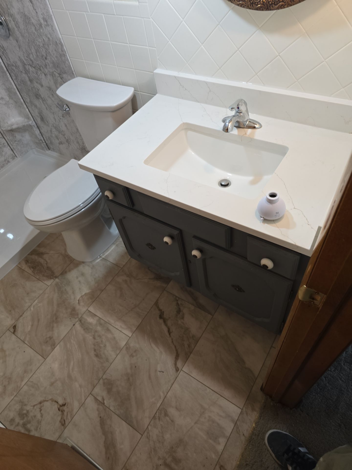 Tub to Shower , flooring, and countertop by The Shower Company