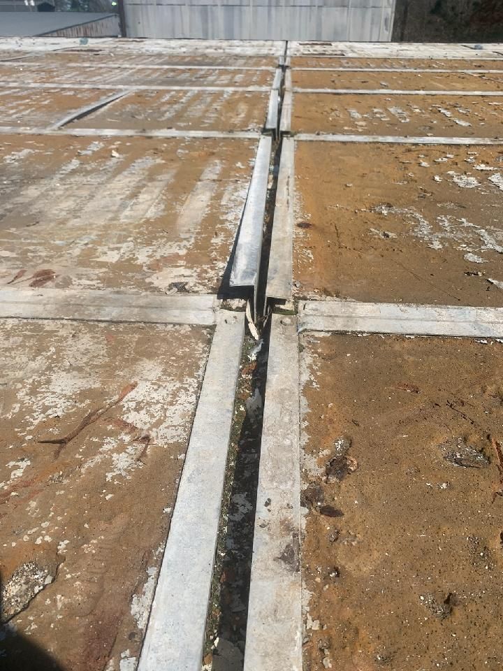 Commercial Roofing Installation using Aluminum Roofing panels by Hostetler Roofing