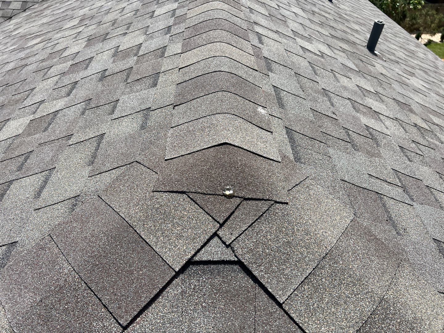 Wind damaged roof replacement by Oakwood Roofing and Construction, LLC