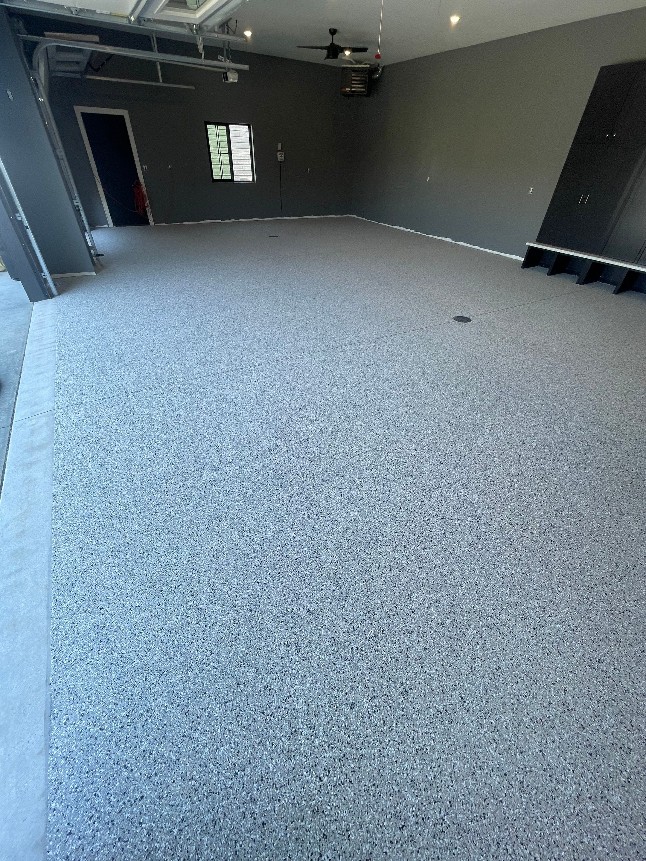 Custom Speckled Concrete Coating for Dell Rapids Garage by Select Painting, Coatings & Garage Cabinets