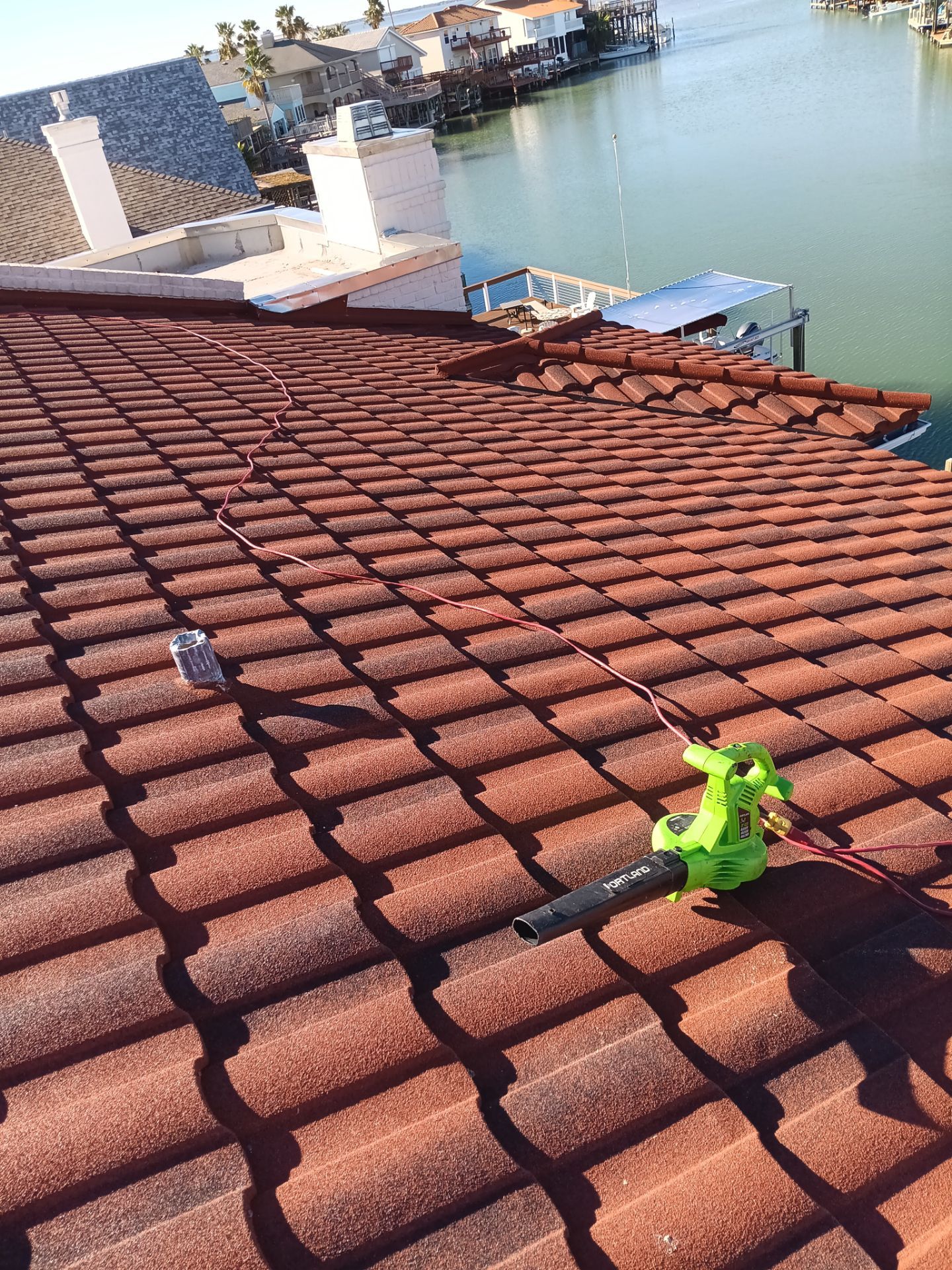 Off with the Tile and on with the TILCOR stone coated metal.  by Bayfront Roofing and Construction