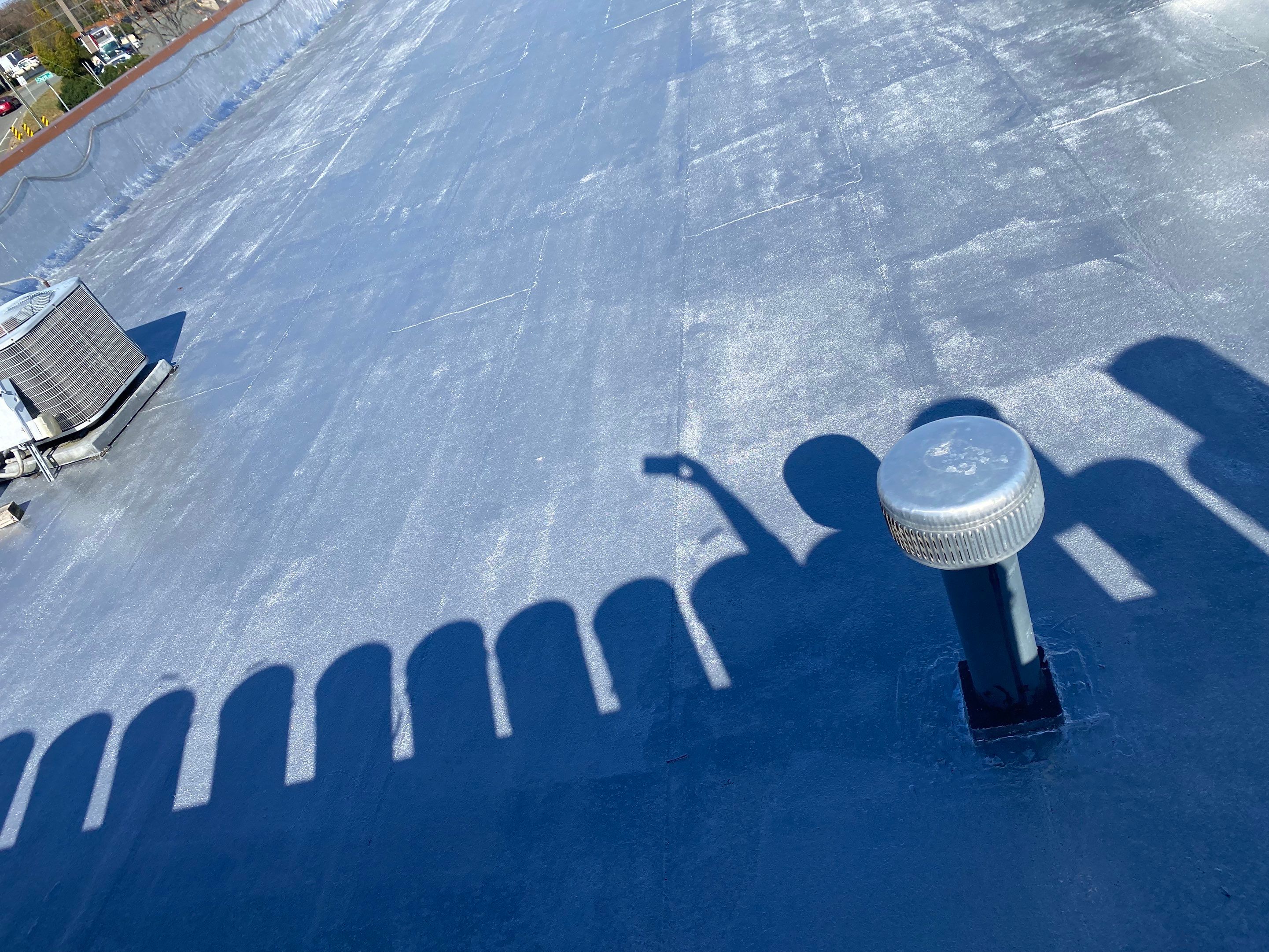 Commercial Coating using Poly Urerthane and Silicone Coating by Just In Time Roofing and Restoration