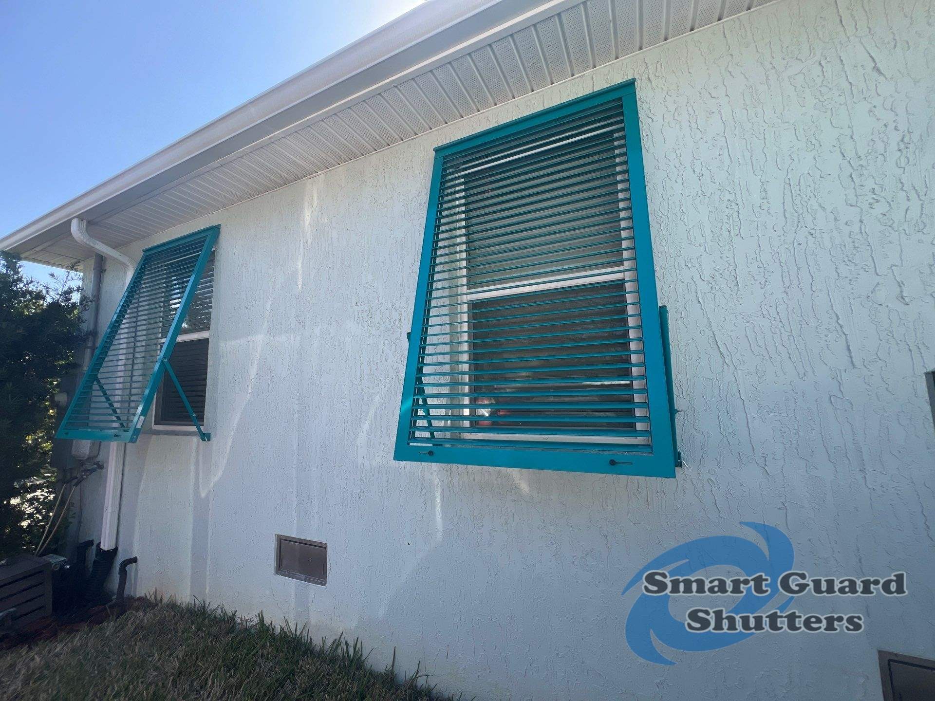 Impact Bahama Shutters in Water Blue by Smart Guard Shutters