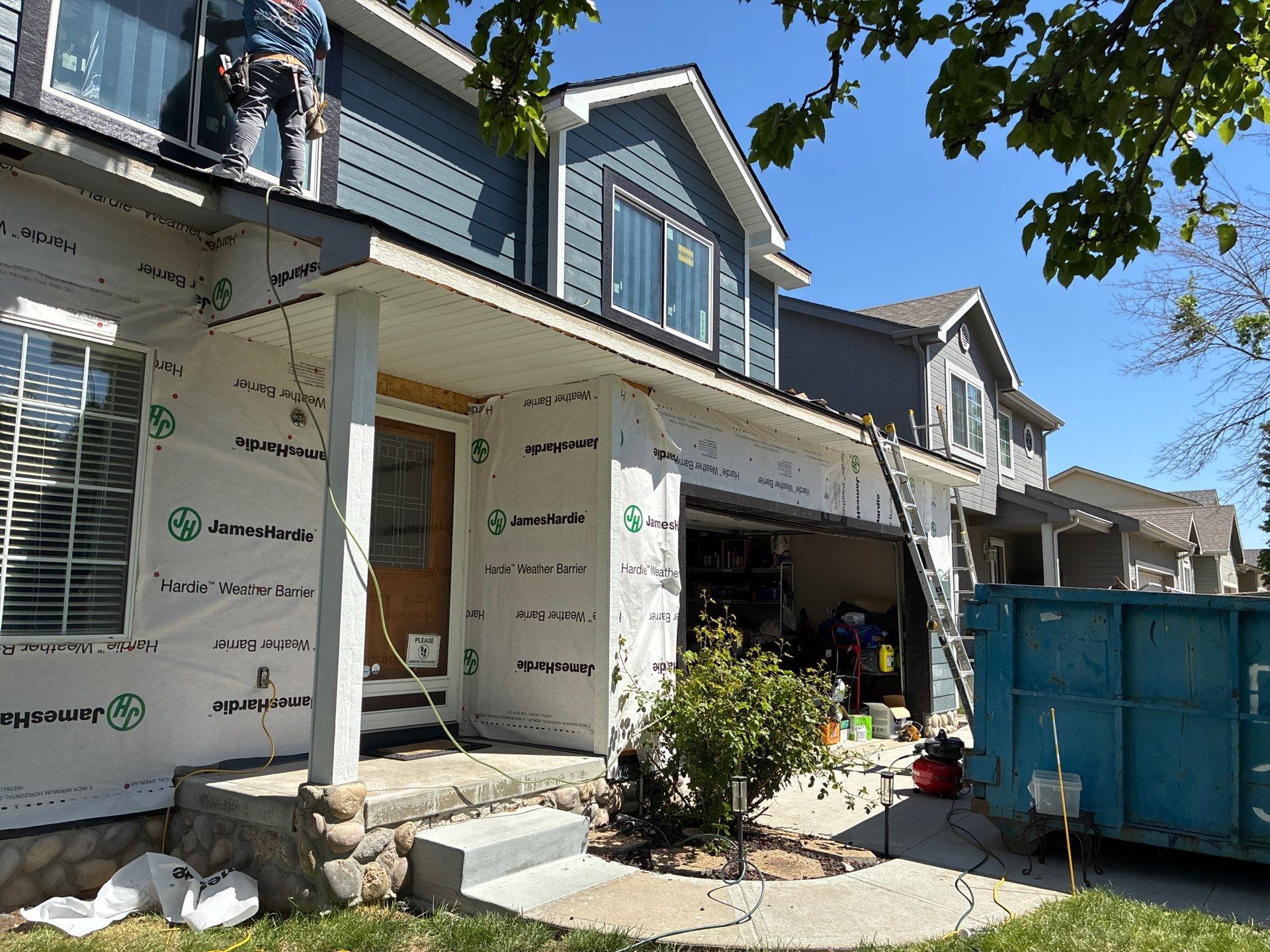 James Hardie Siding and Window Replacement with Arctic White Trim by Carps Complete Exteriors