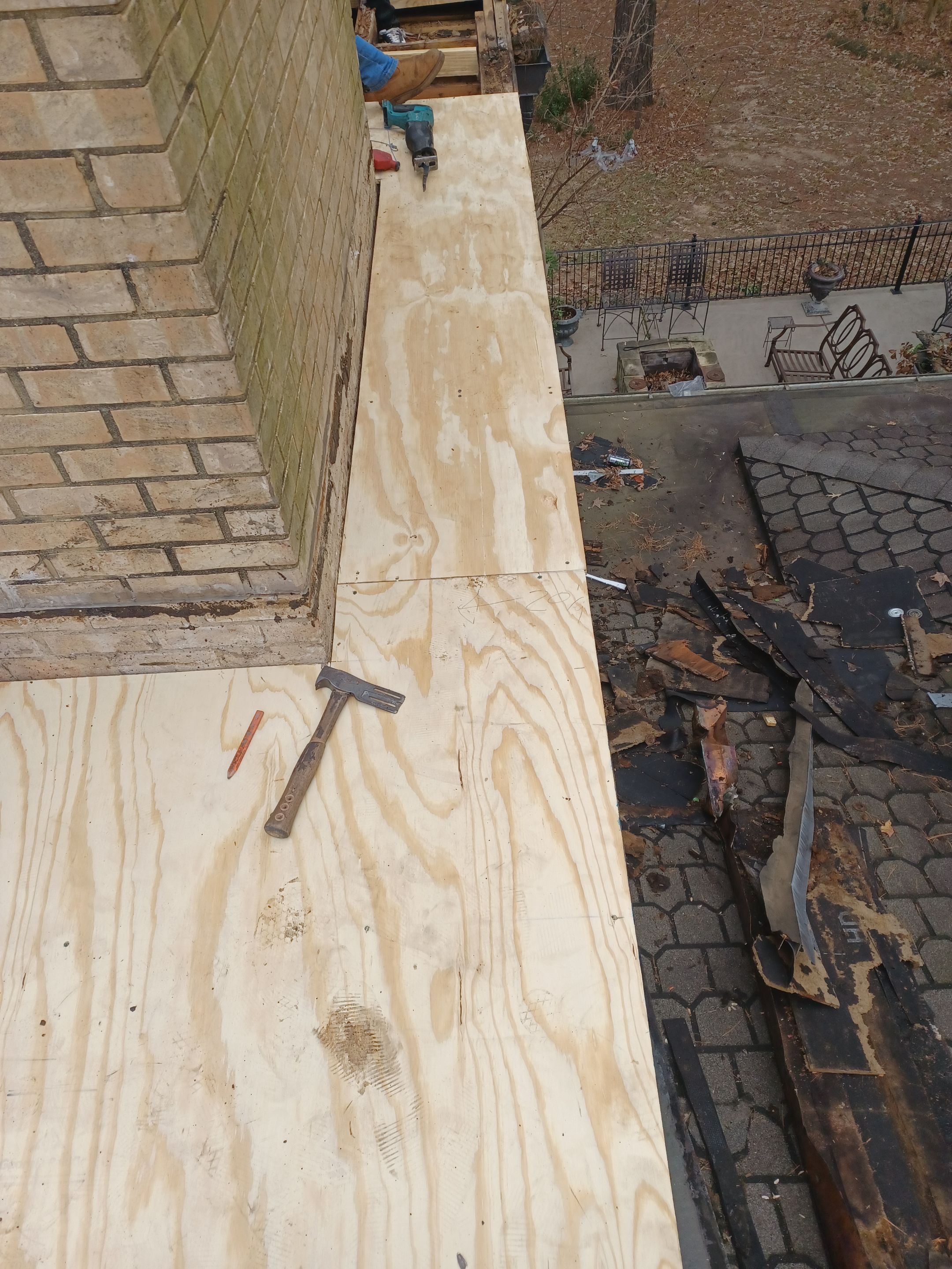 Residential Roofing Installation using PVC membrane and 24 gauge Standing Seam Metal by Hostetler Roofing