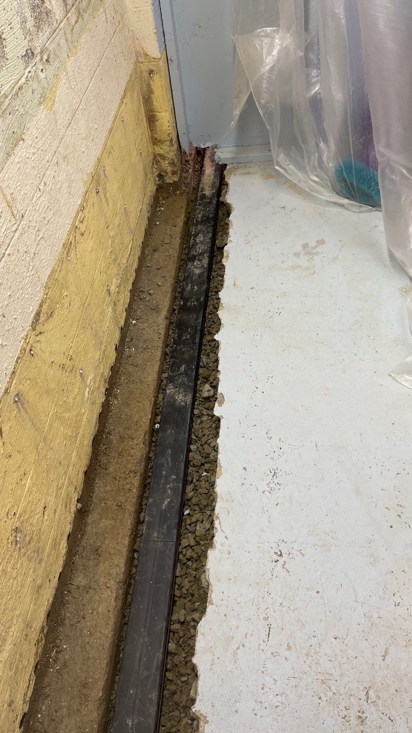 Interior Waterproofing Using GrateDrain™ Products by Toledo Basement Repair 