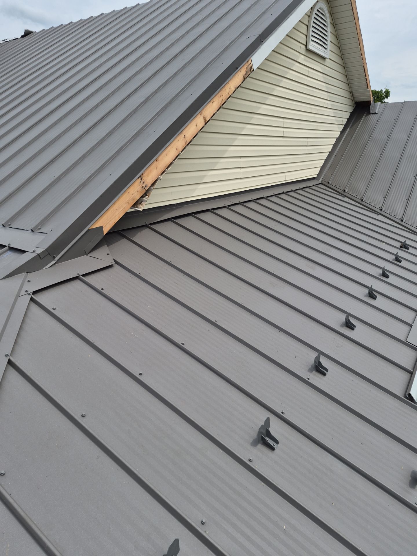 Newport Metal Roof Replacement with New Skylights by Esh Builders