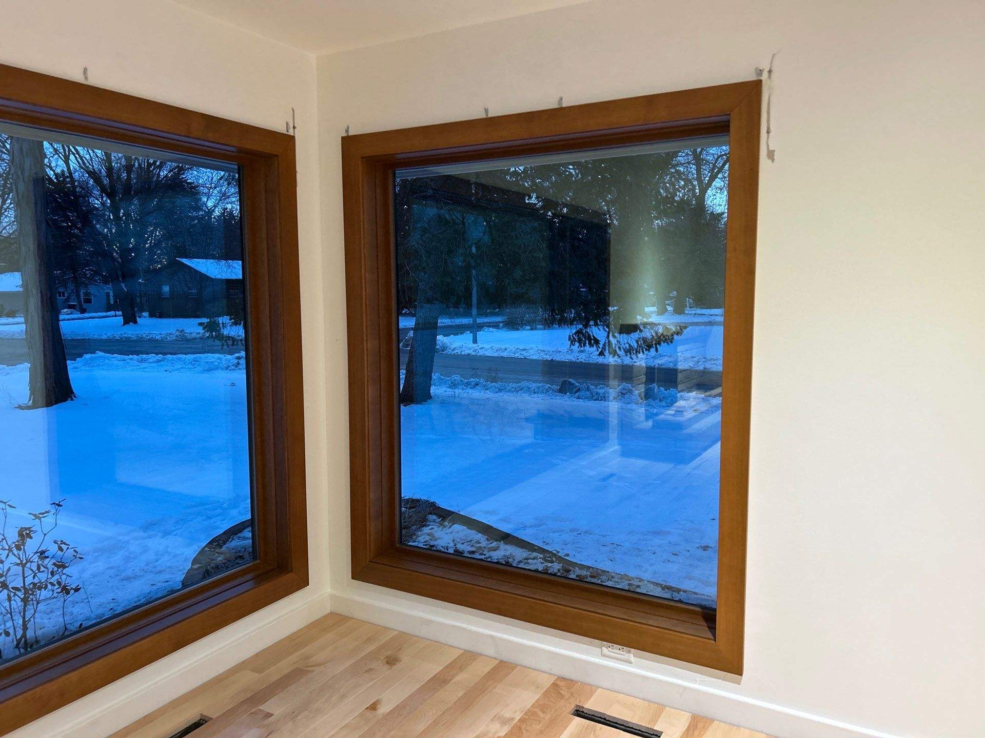 Black-Frame Pella Lifestyle Upgrade on a Partial Brick Home by United Windows and Siding LLC