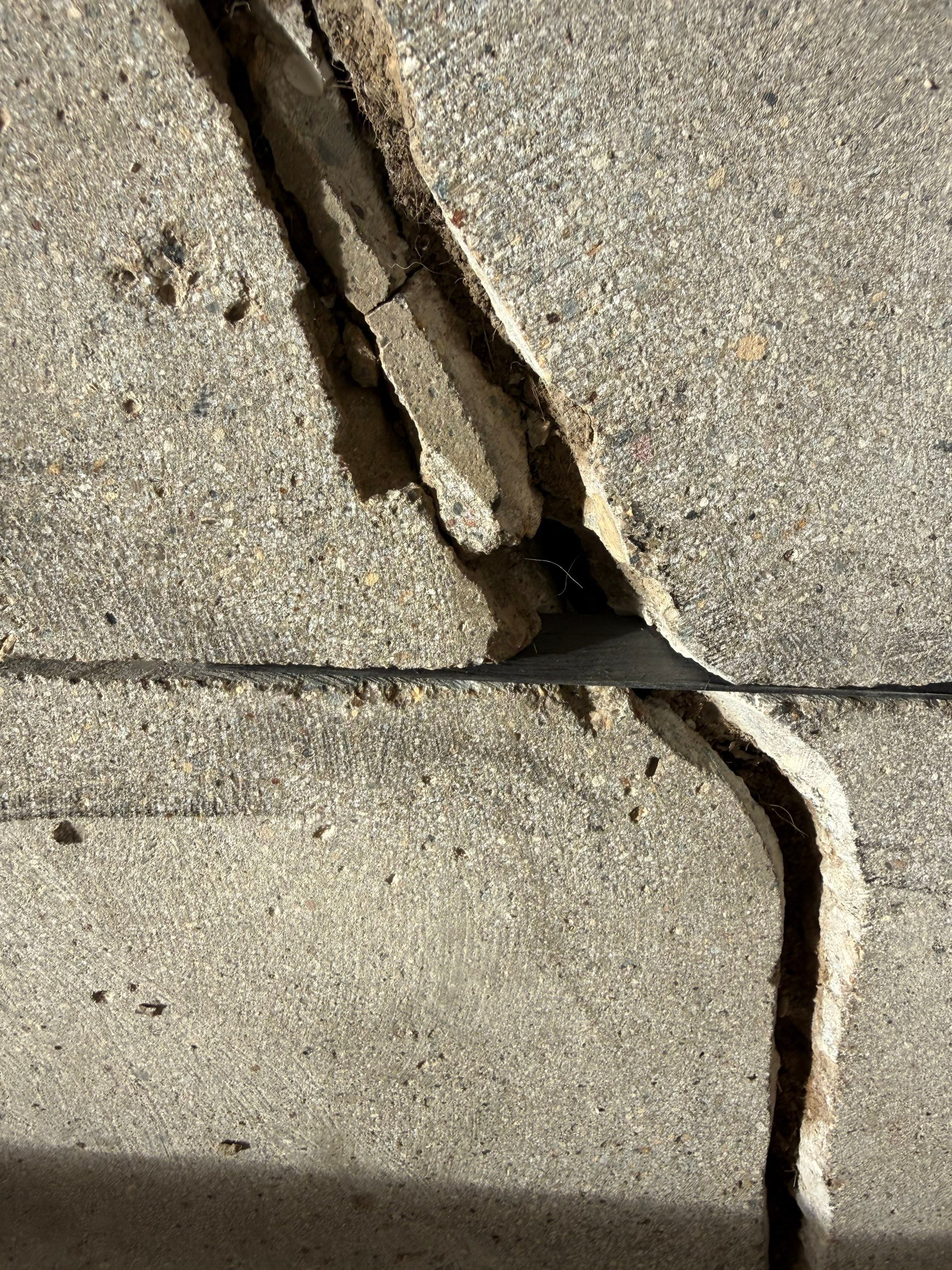 Feather Grey Garage Floor Coating and Crack Repair in Beresford by Select Painting, Coatings & Garage Cabinets