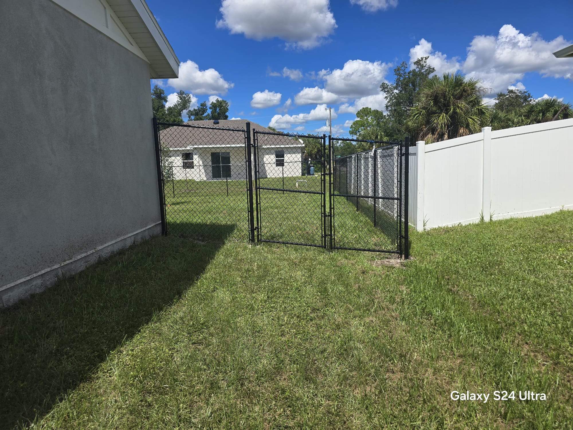 Residential Black Chain Link Fence Installation in North Port by True Fence LLC
