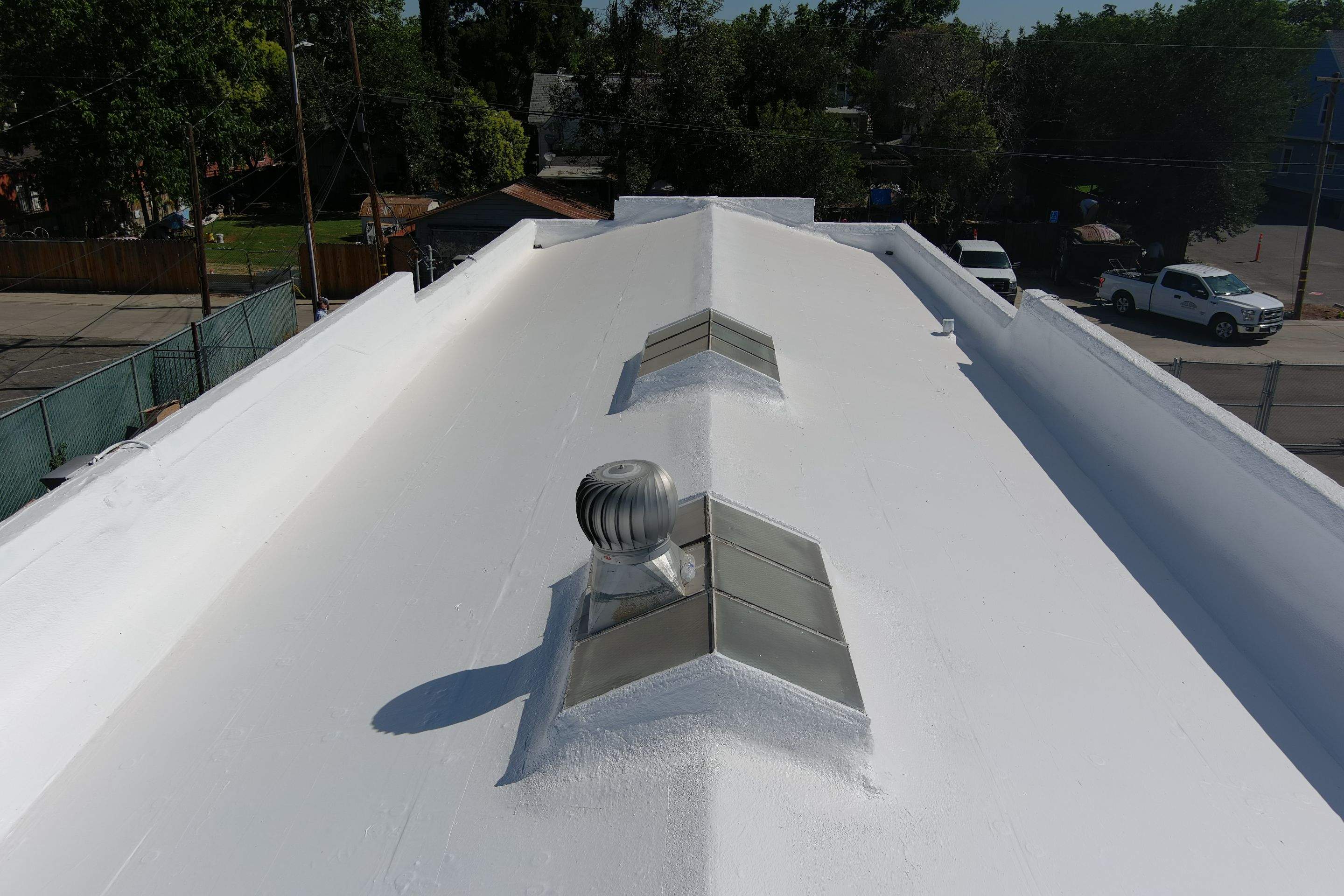 Commercial Roofing Installation using Conklin BenchPly system with PUMA top coat (imbedded fabric system) by Straight Edge Roofing Inc