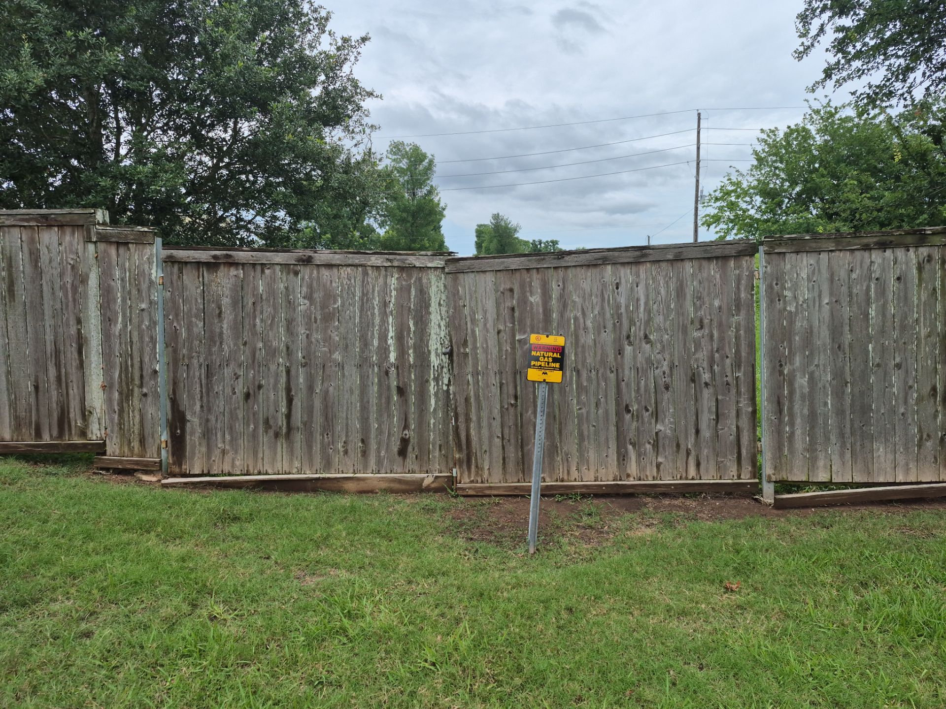 Wood Fence Installation for HOA by Tim's Fences