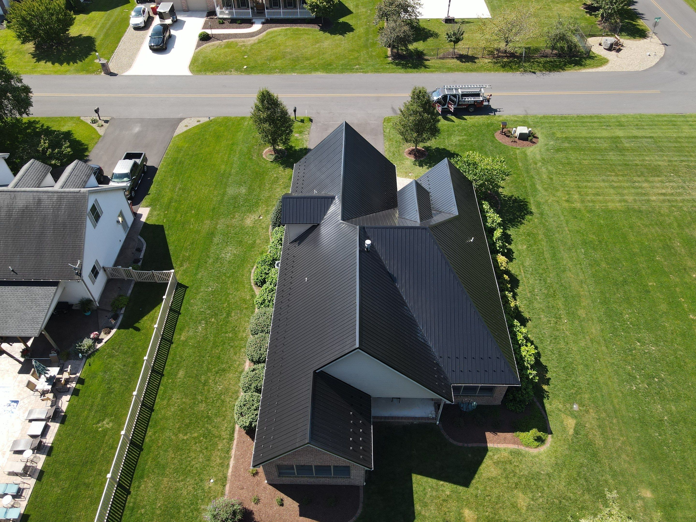 Standing seam / Azm panel in black  by Teflon Roofing