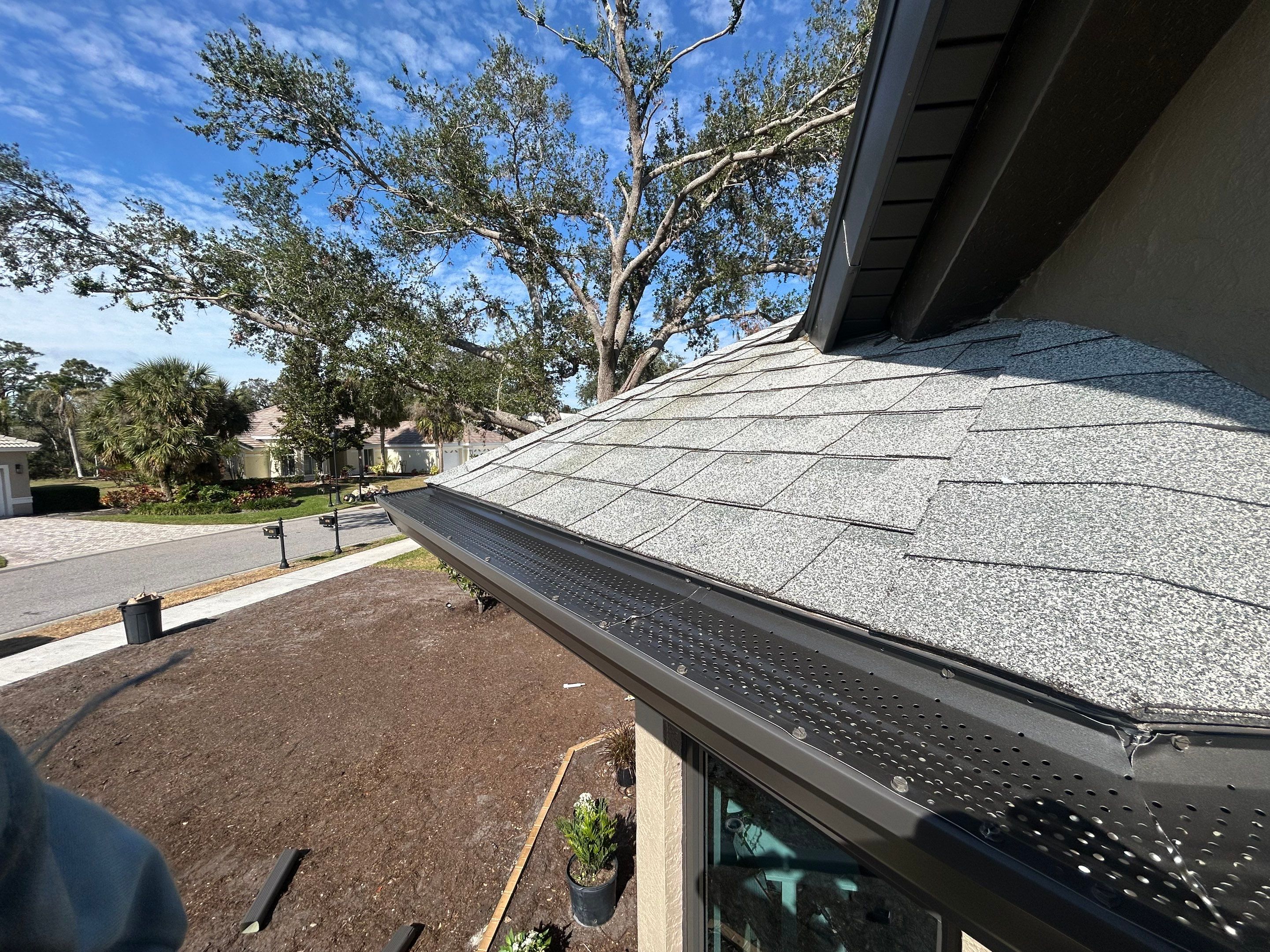 Black Seamless Gutters in Sarasota FL by Gutter Professors