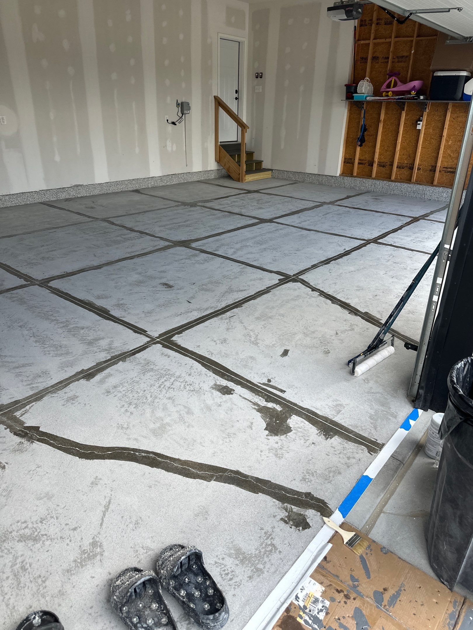 Three-Stall Garage Epoxy Floor Coating Installation in Lincoln by Goat Coatings