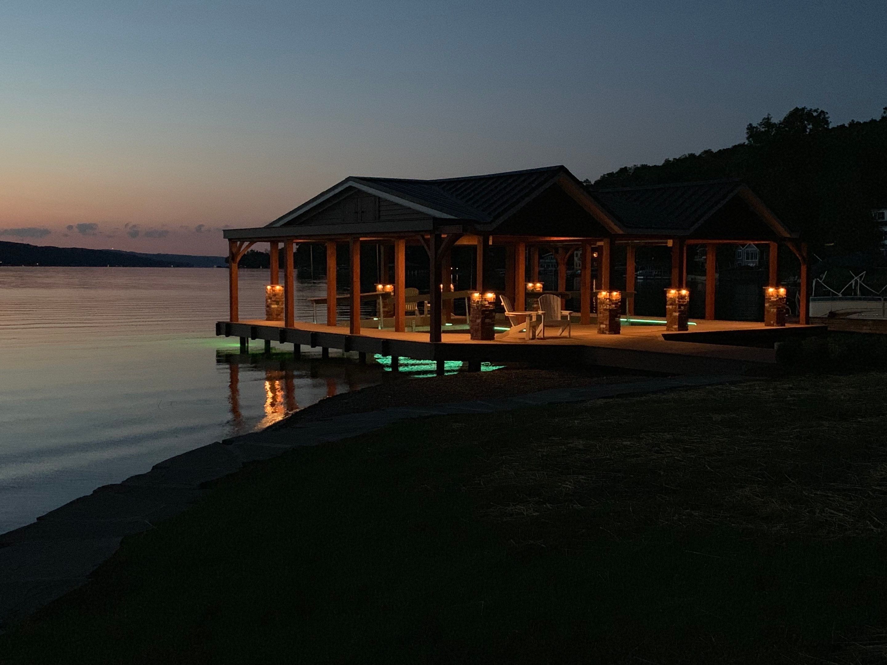 Custom Timber-Framed Boat Dock with Multi-Color LED Lighting on Keuka Lake, New York by Outdoor Lights + Shades