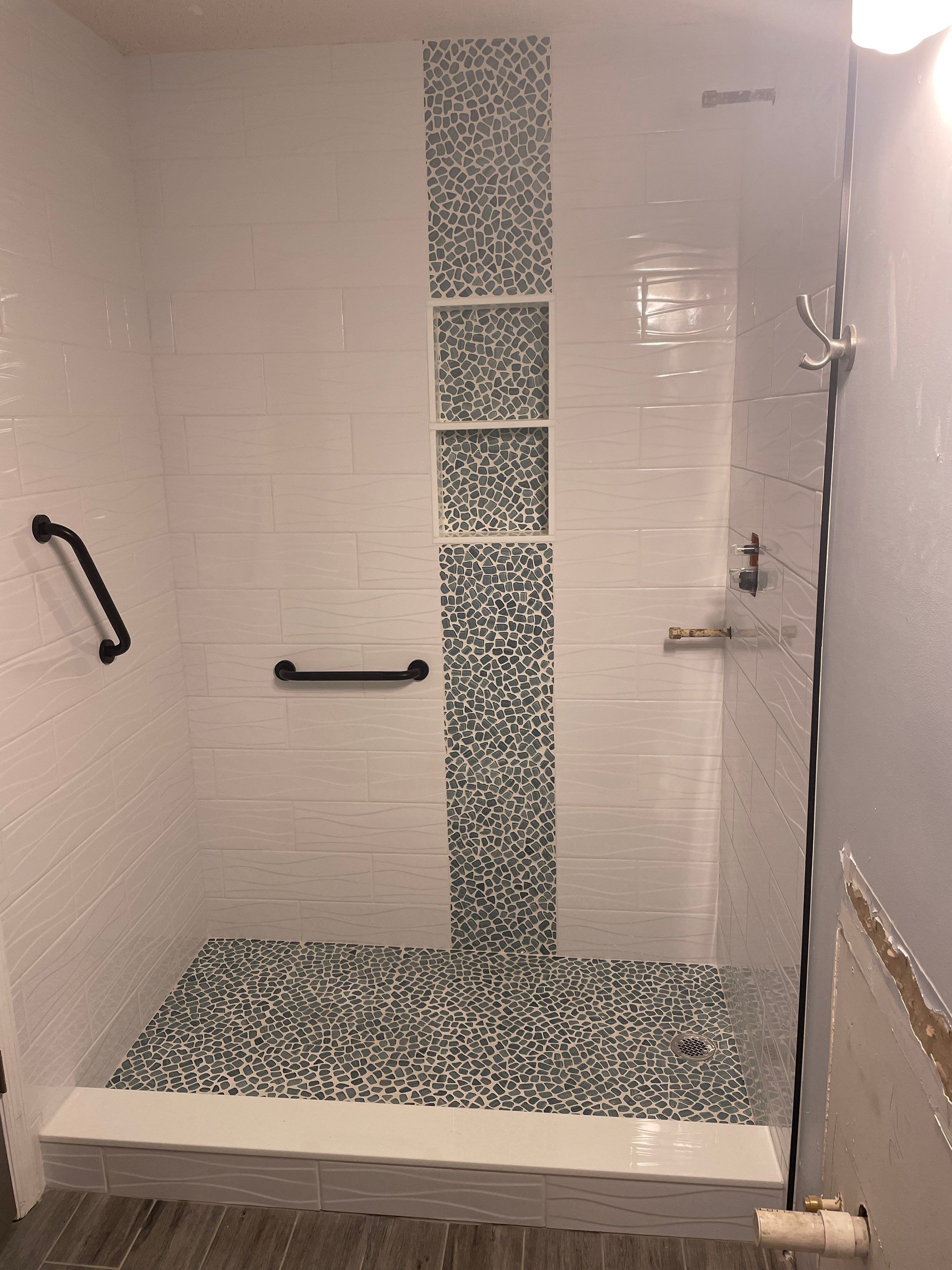 Sleek bathroom shower remodel by Footprints Floors of East Atlanta