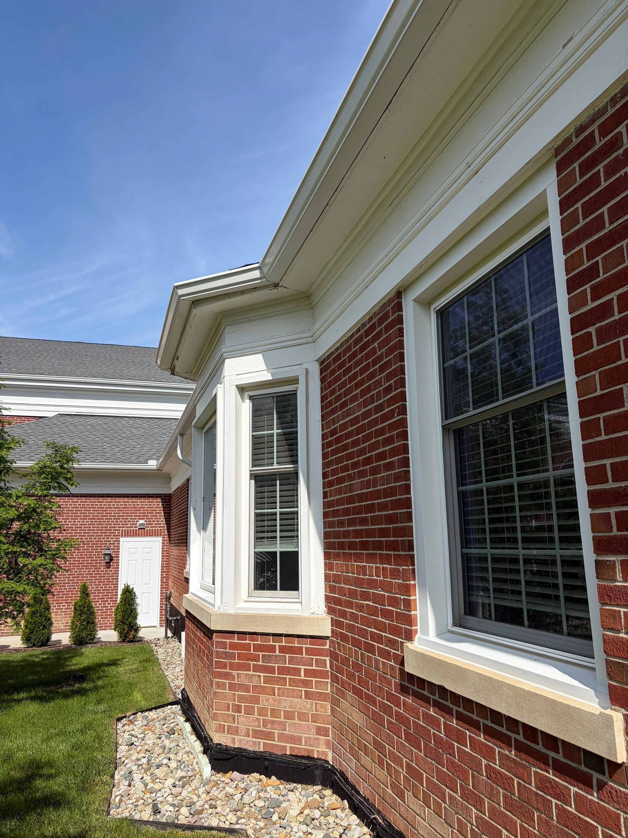 Commercial Wood Trim Restoration and Gutter Replacement in Birmingham by Top Shelf Painter