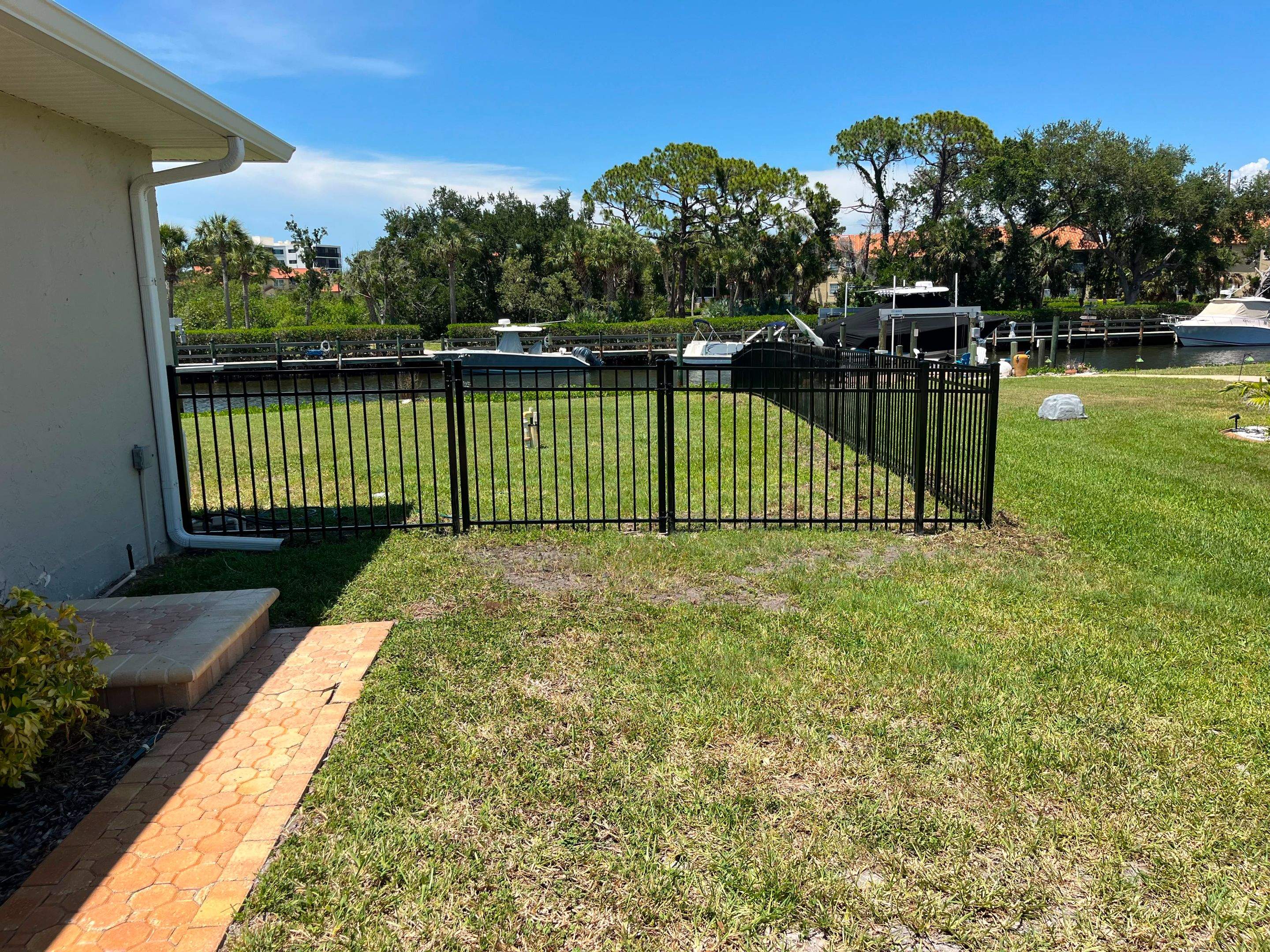 Black Aluminum Waterfront Fence Installation in Osprey by True Fence LLC