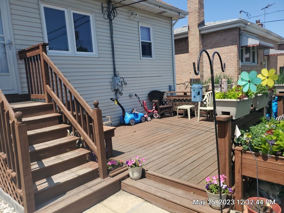 Wood cleaning and staining using Armstrong cloark oil stain by Northern Power Washing LLC.
