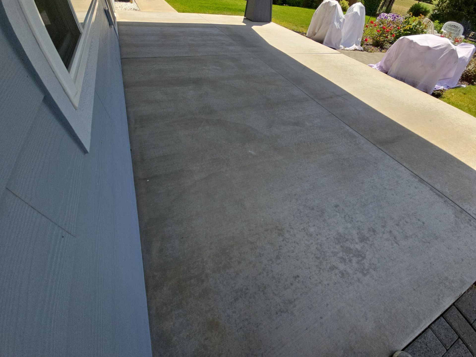 Sandpoint Patio Transformation With Agate And Battleship Hybrid Coatings by Croc Coatings, LLC