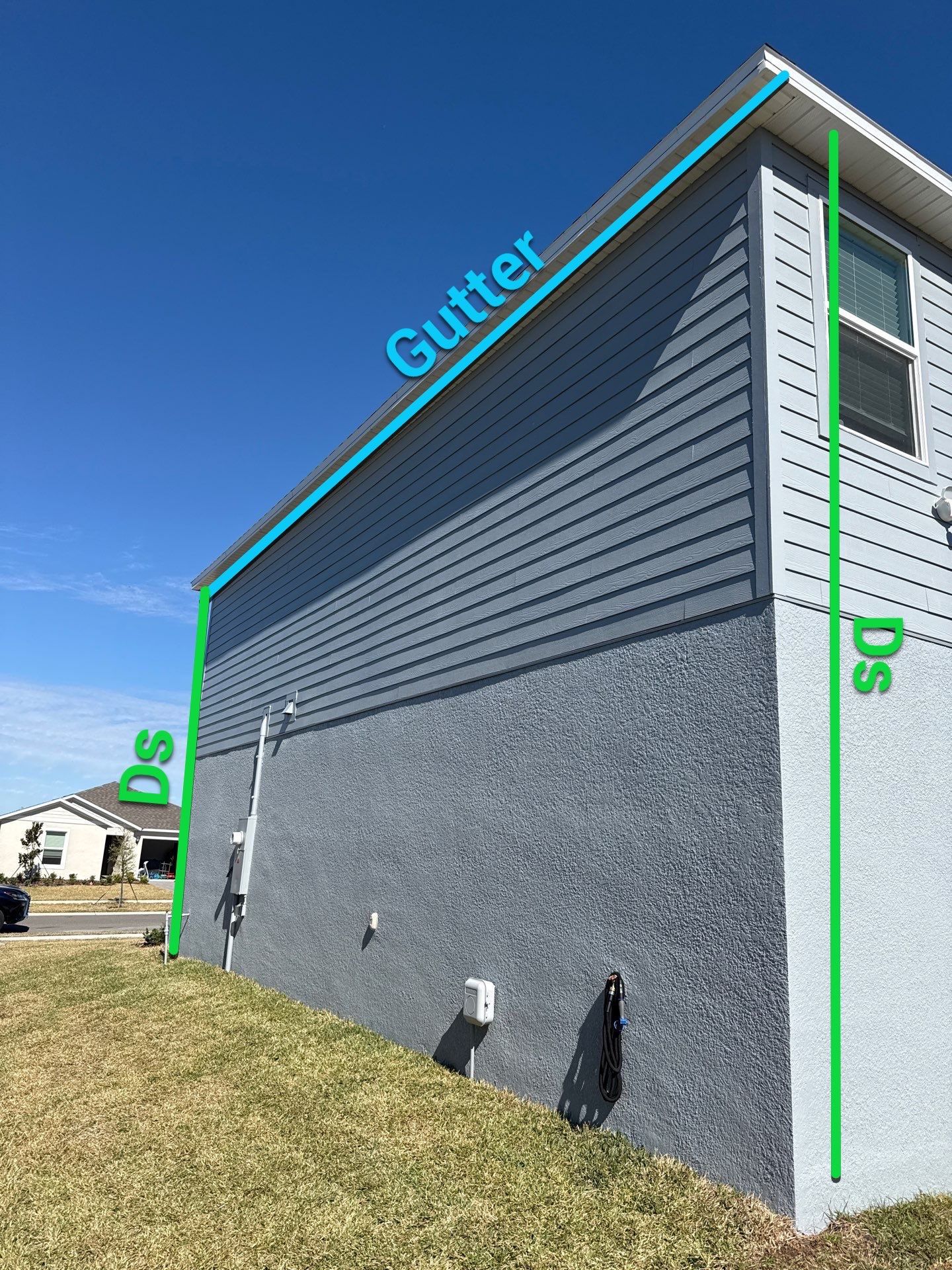 White Down Spouts and Seamless Gutters using downspouts in Dade City FL by Gutter Professors