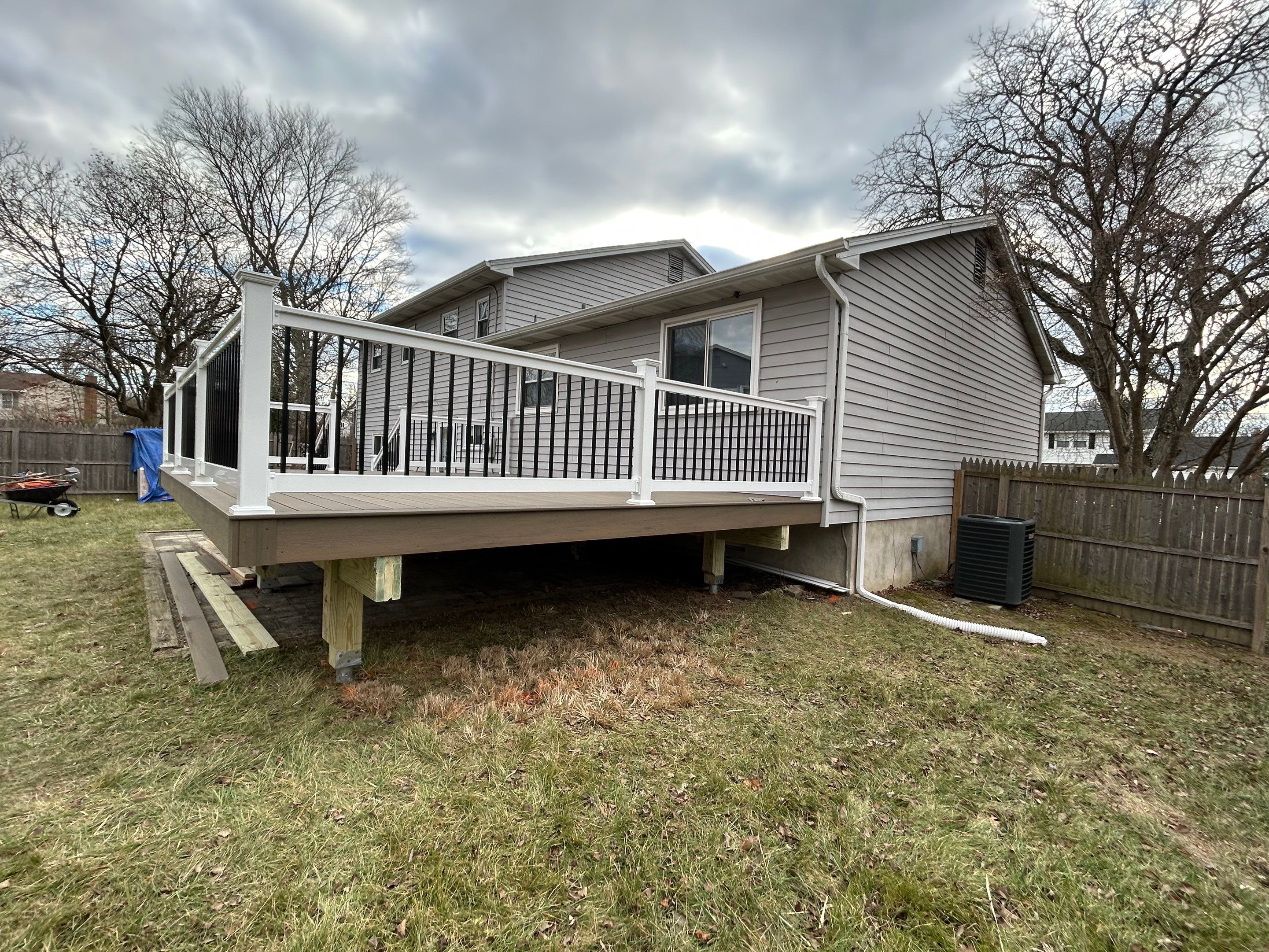 New deck construction and replacement of window with new sliding door  by deck guardian