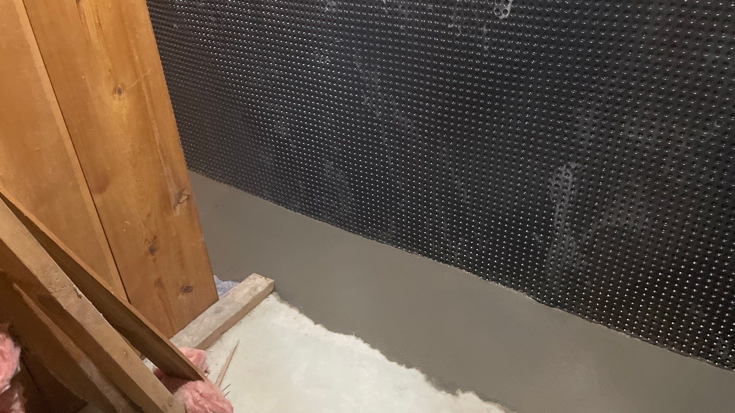 Interior Drain Tile & Buried Discharge in South Minneapolis by Waterproofing Northeast