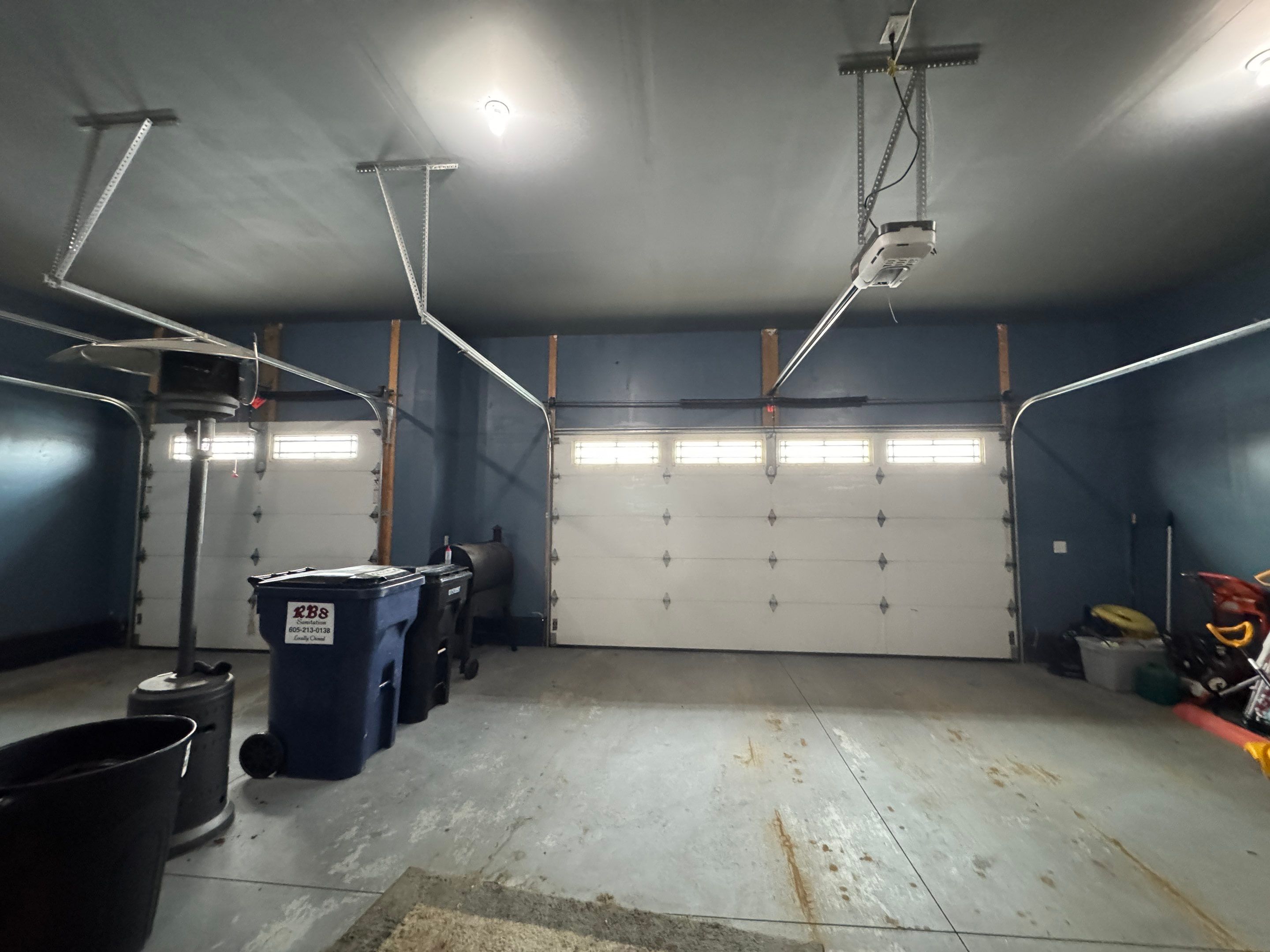 Grey Speckled Epoxy Garage Floor and Stair Coating in Sioux Falls by Select Painting, Coatings & Garage Cabinets