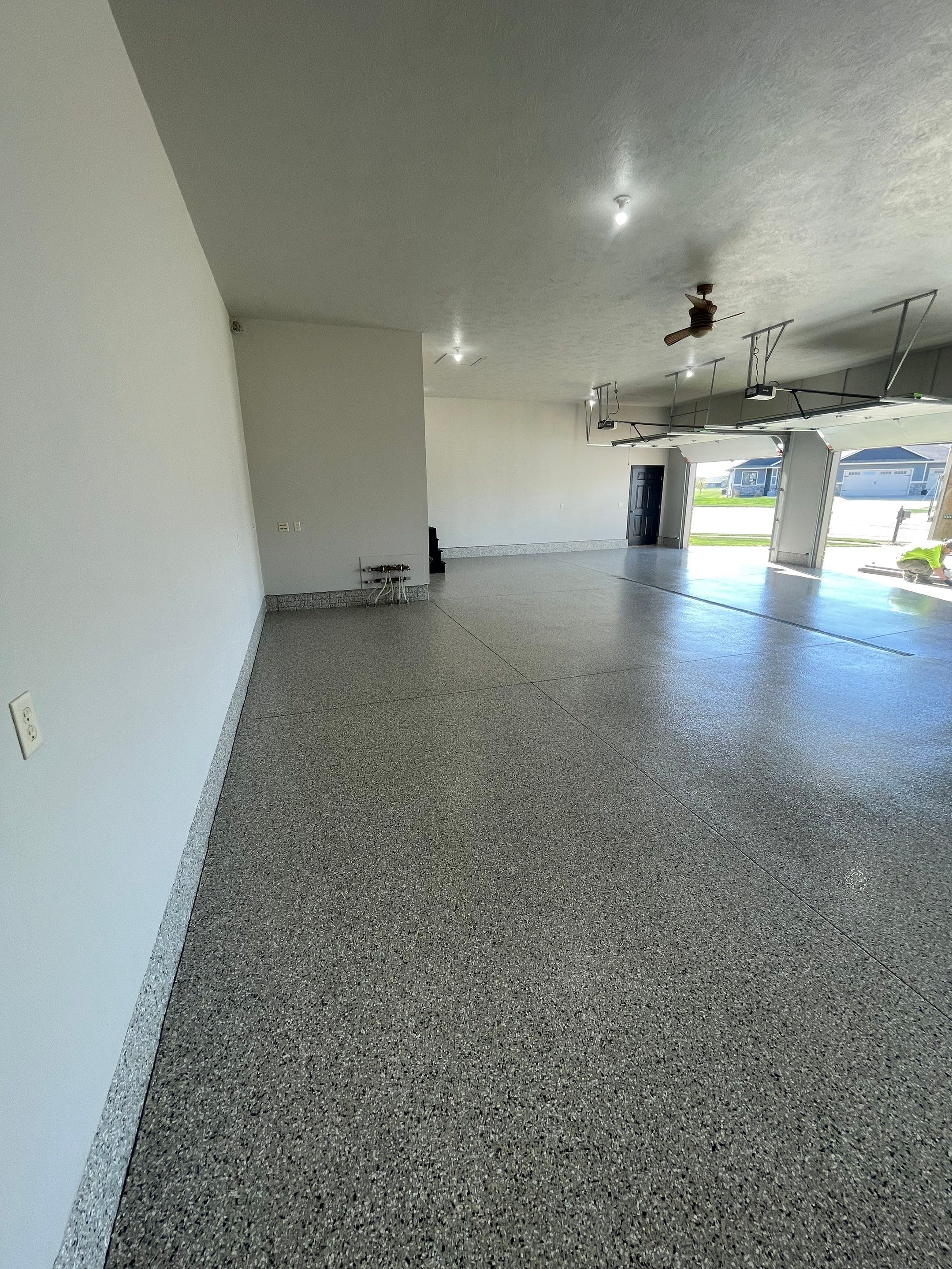 Multi-Car Garage Epoxy Floor Coating in Beresford by Select Painting, Coatings & Garage Cabinets