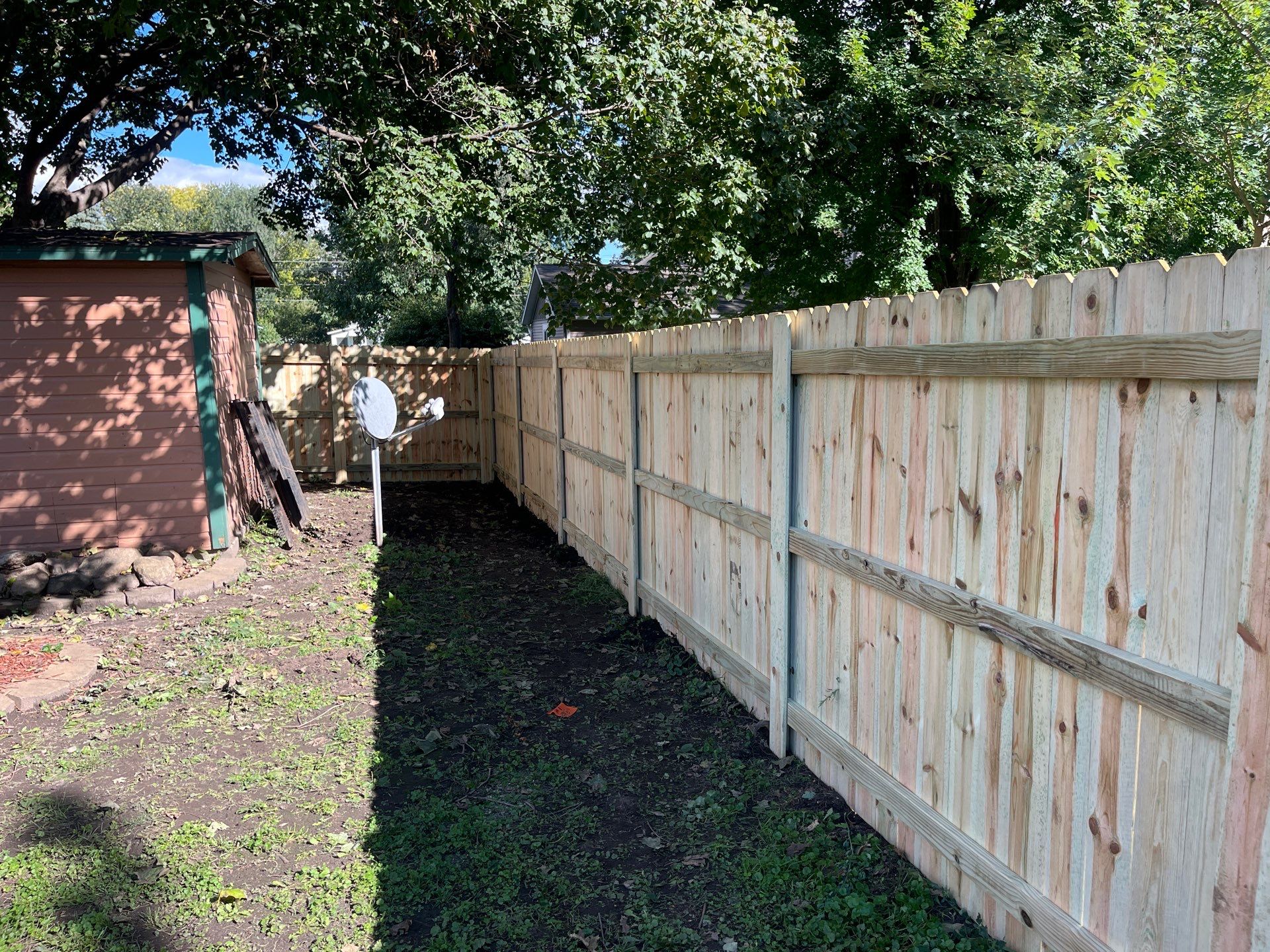 Pressure-Treated Wood Privacy Fence Installation in Waverly, Iowa by Perfect Picket Fence and Stain