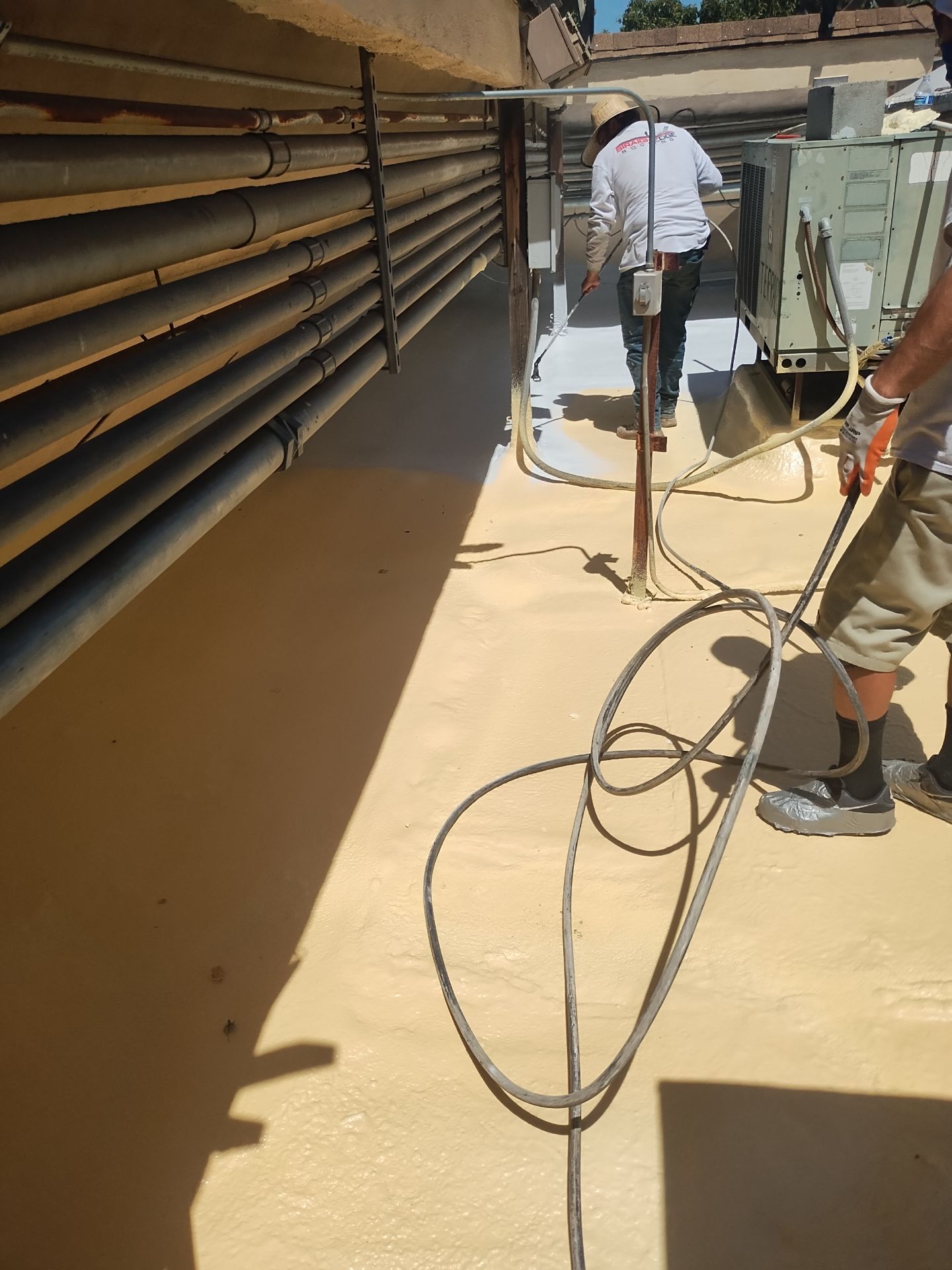 Spray foam and coatings using General Coatings acrylic coatings and spray foam by Straight Edge Roofing Inc