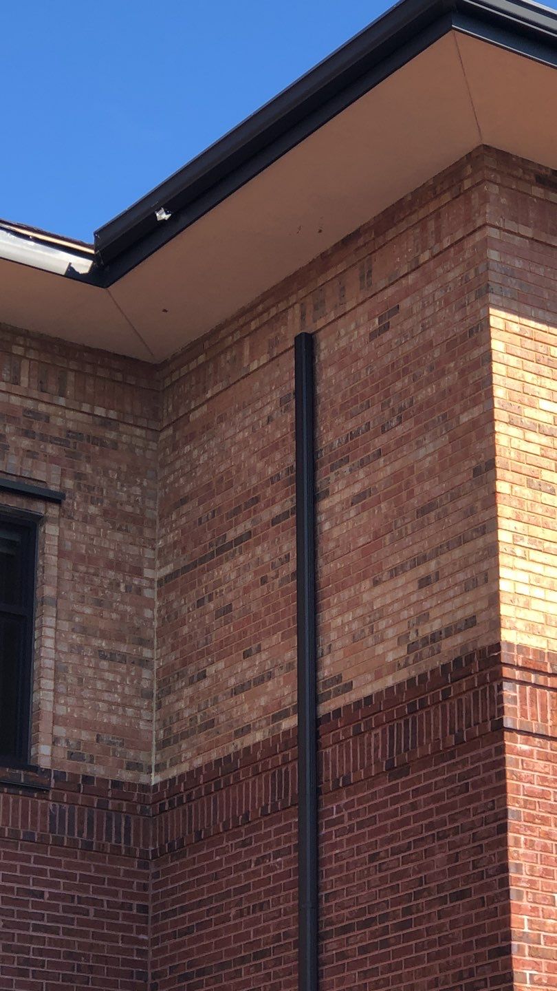 Pensacola Realtor Association Gutter Installation using K-Style White Gutters by Gutter Professors