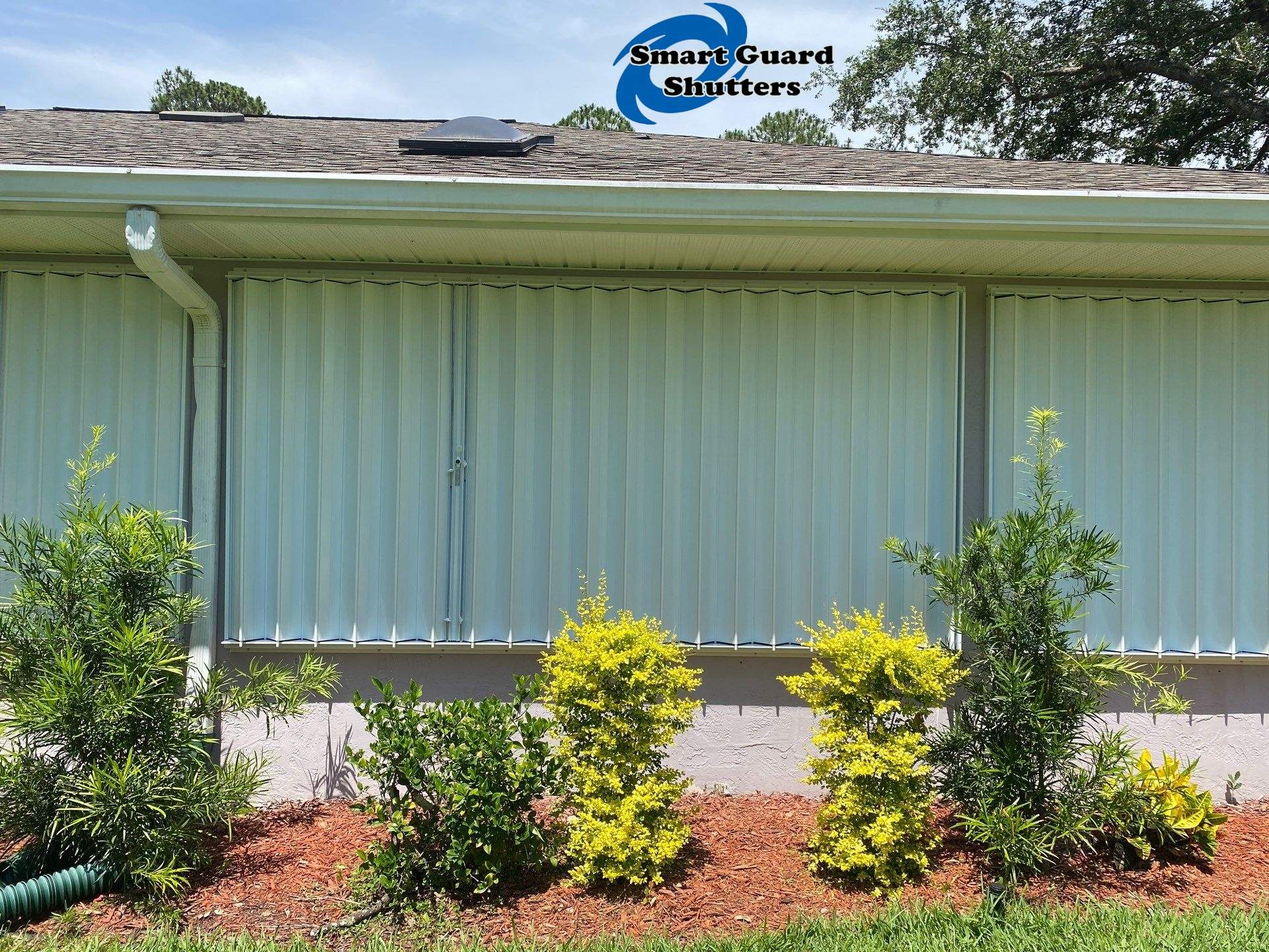 Accordion Shutters in White by Smart Guard Shutters