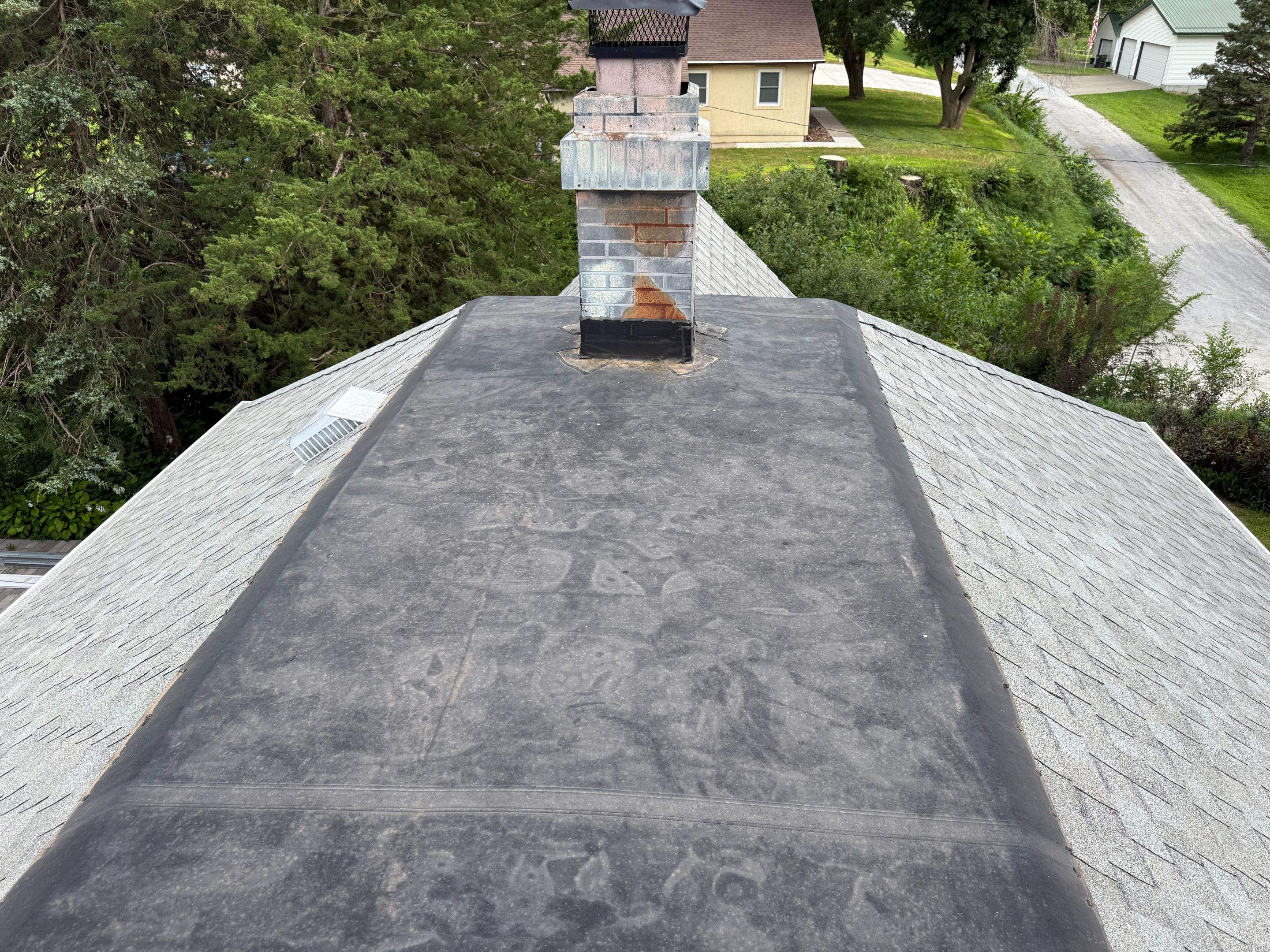 Asphalt Shingle and EPDM Membrane Roof Installation in Mineola by Star Home