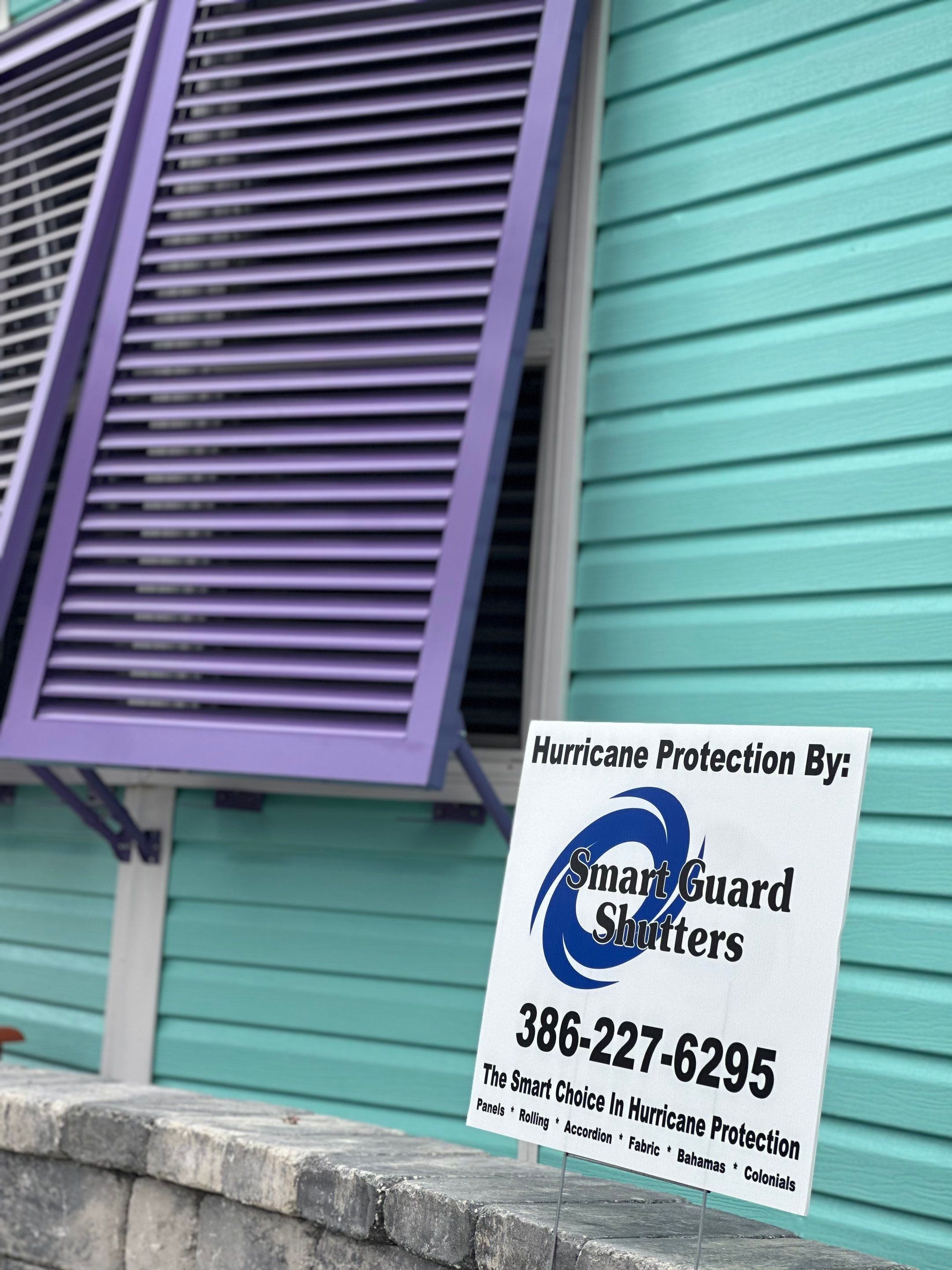 Hurricane Rated Bahama Shutters in Pearl Violet by Smart Guard Shutters