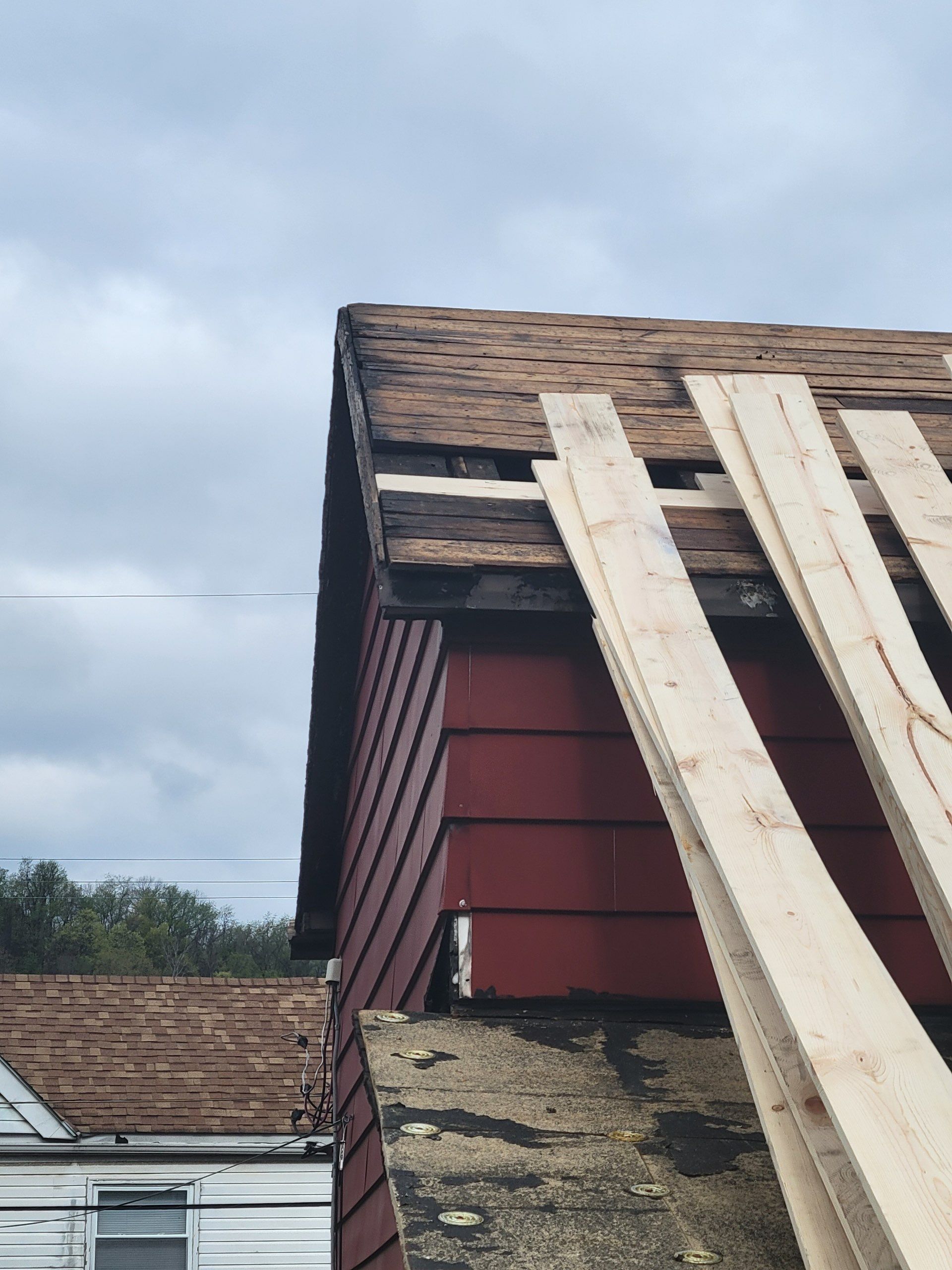 Roof sunspace deck  by Cousins Roofing Siding & Decks