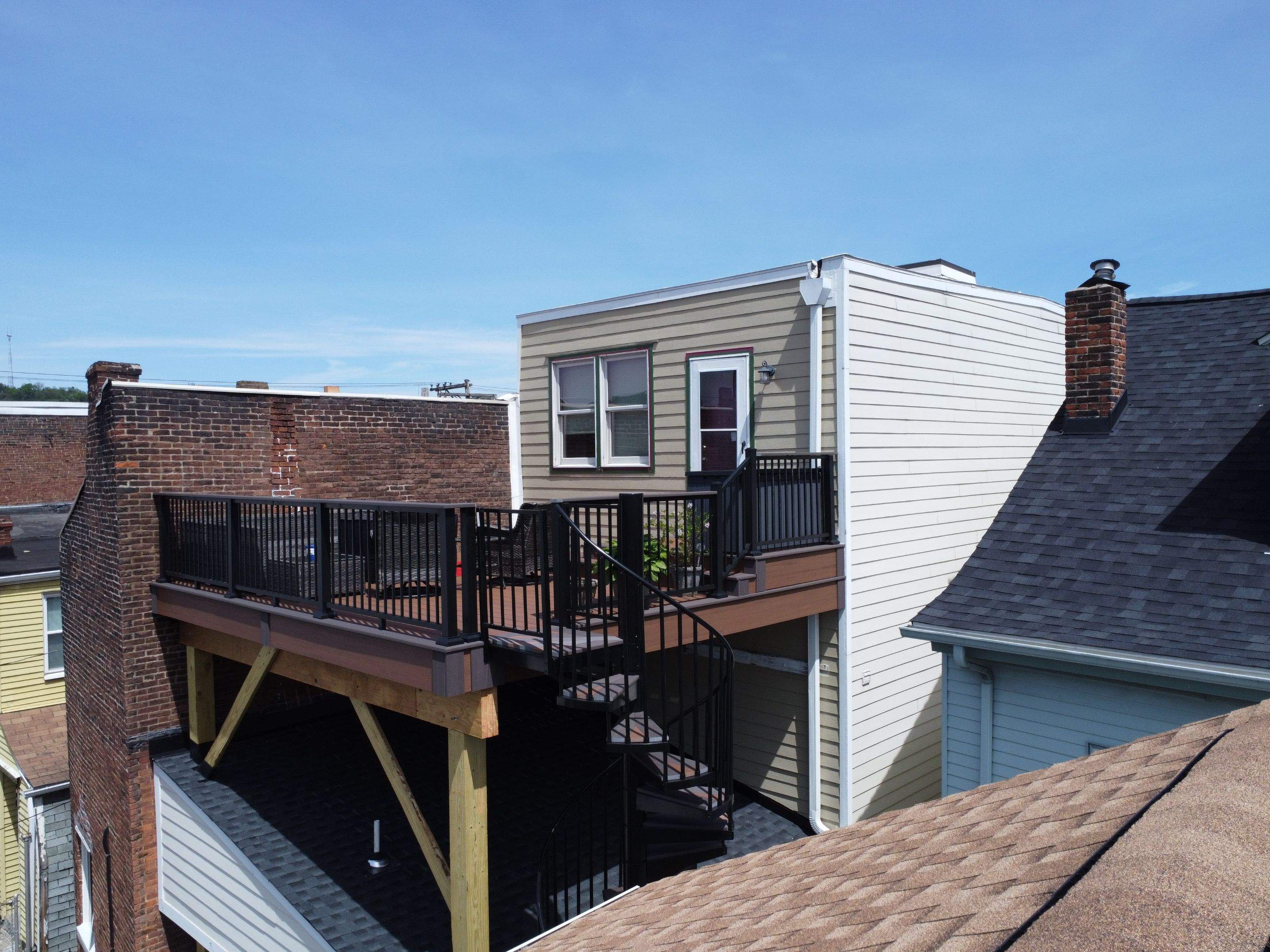 Elevated Multi-Level Composite Deck with Spiral Staircase in Pittsburgh by Cousins Roofing Siding & Decks