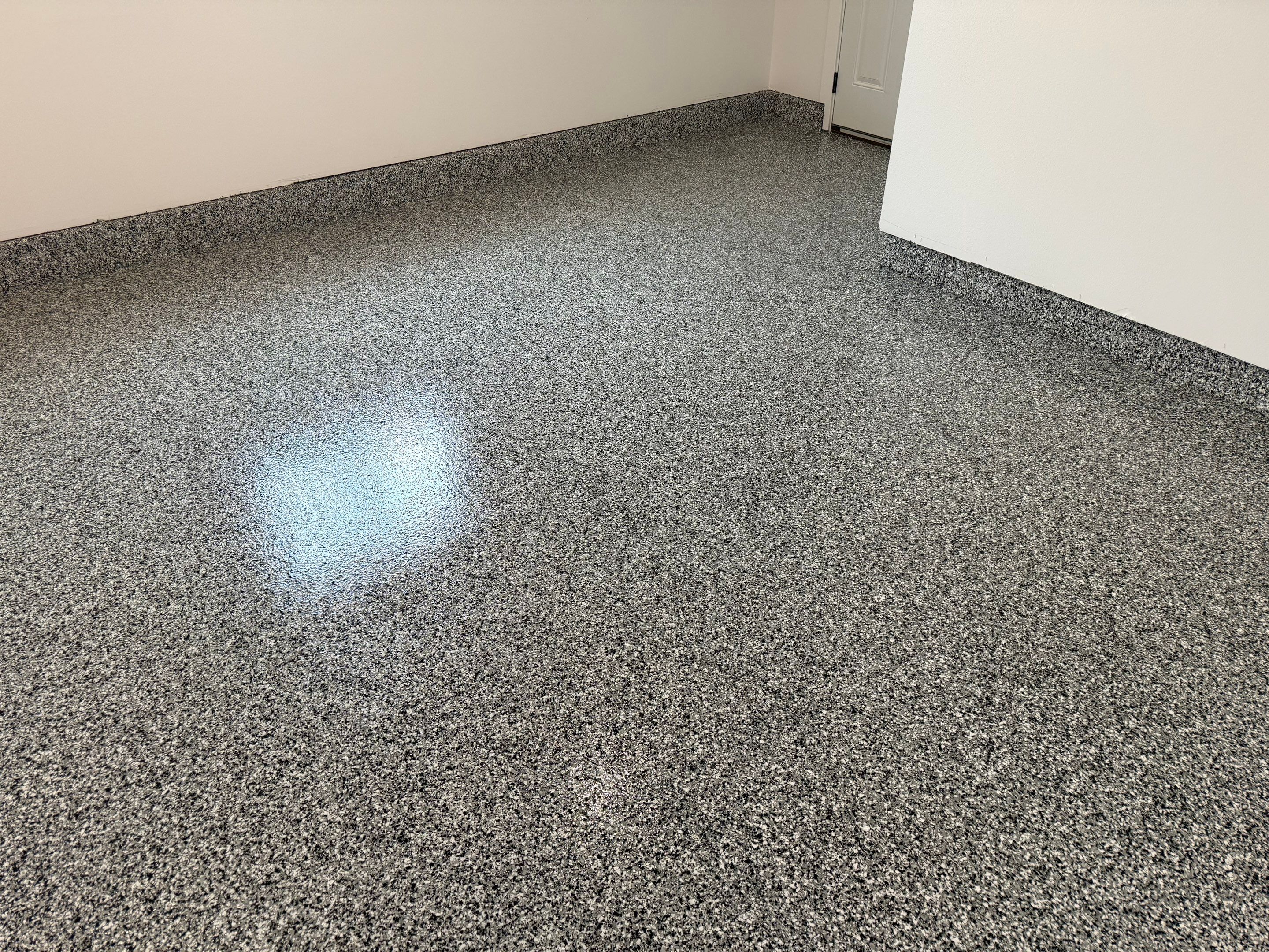 Multi-Car Garage Epoxy Floor Coating and Concrete Finishing in Sioux Falls by Select Painting, Coatings & Garage Cabinets