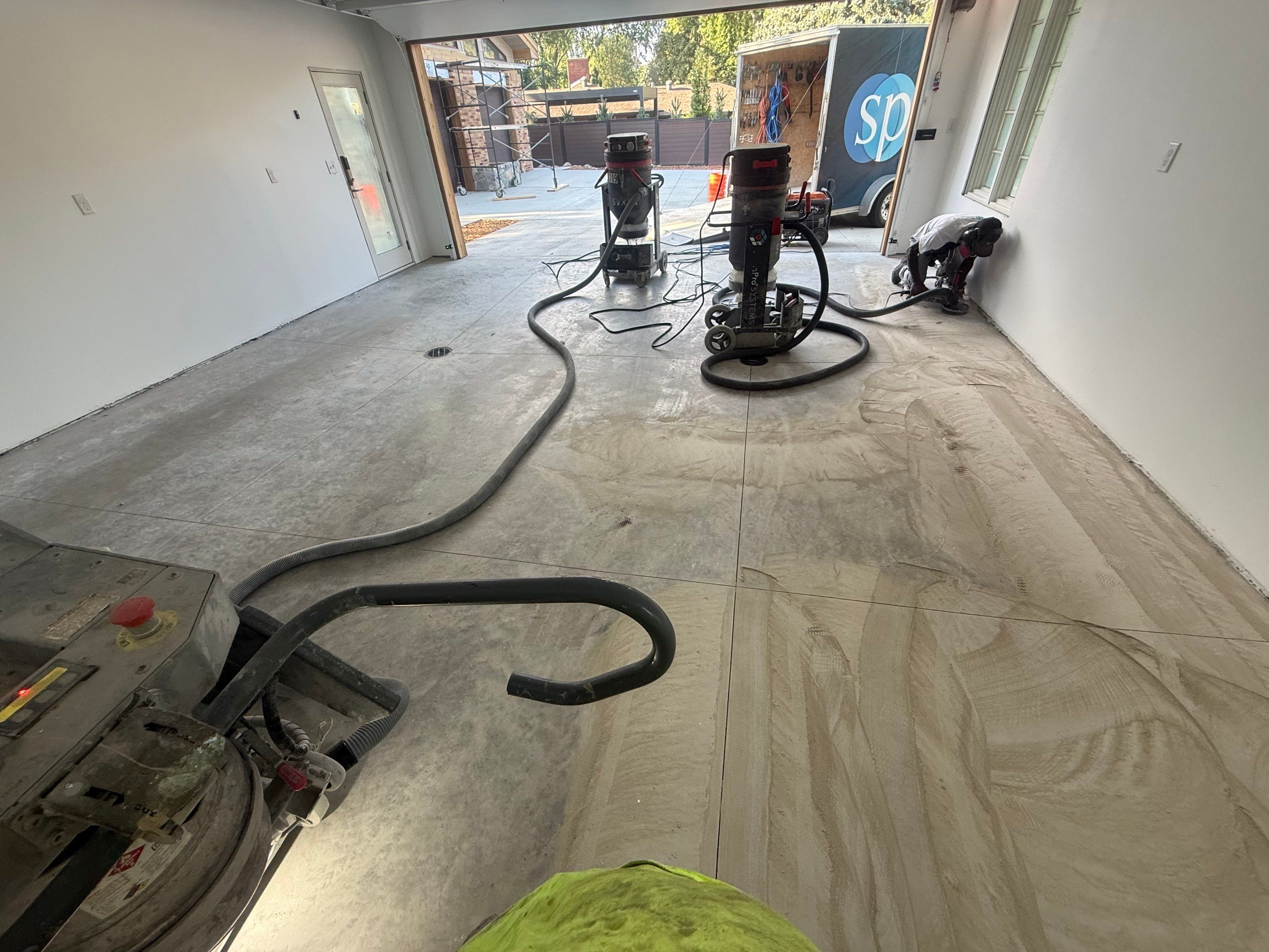 Multi-Car Garage Floor Coating Installation in Sioux Falls by Select Painting, Coatings & Garage Cabinets