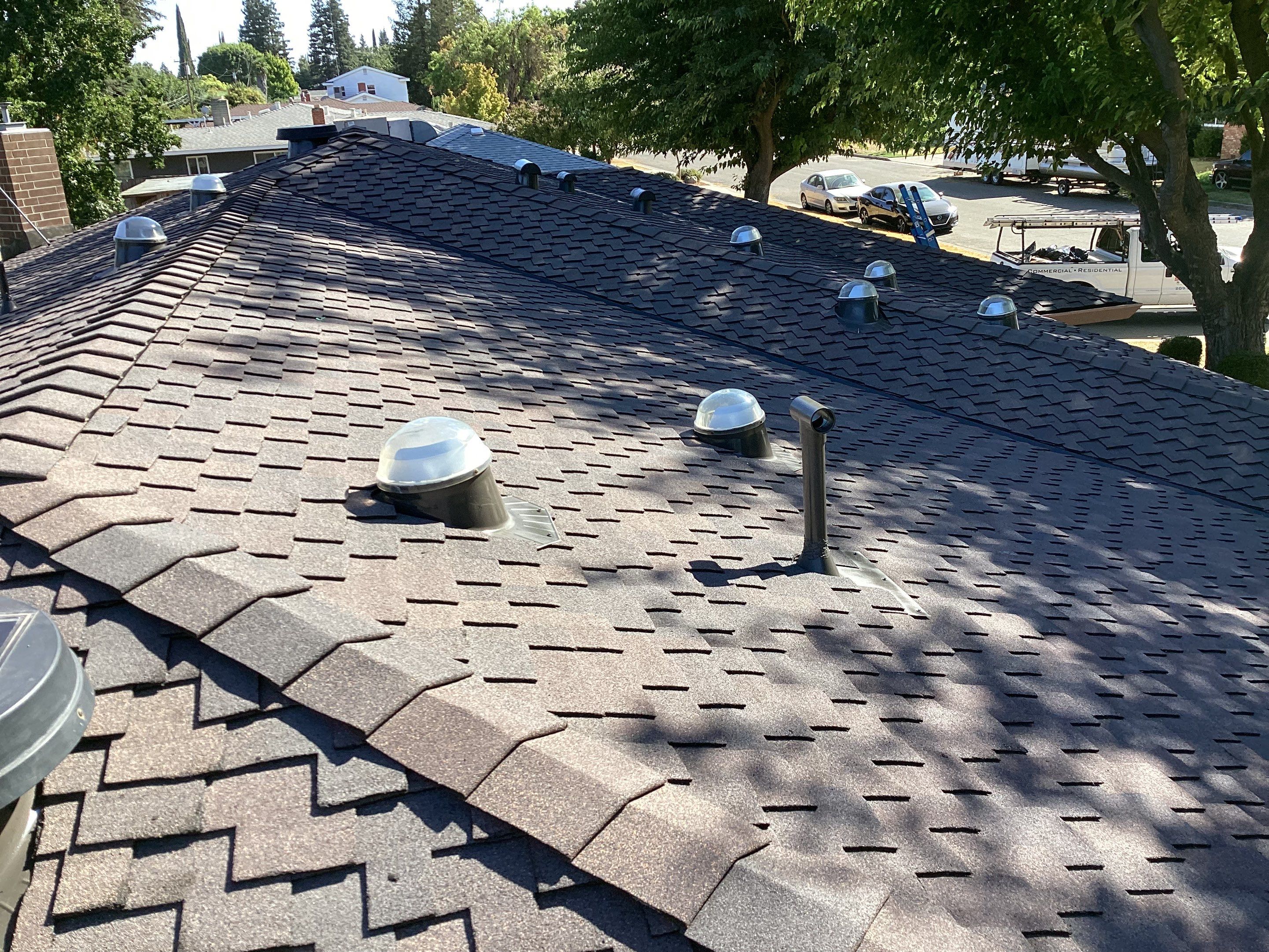 Installation of Certainteed Presidential shingles on residential house by Straight Edge Roofing Inc