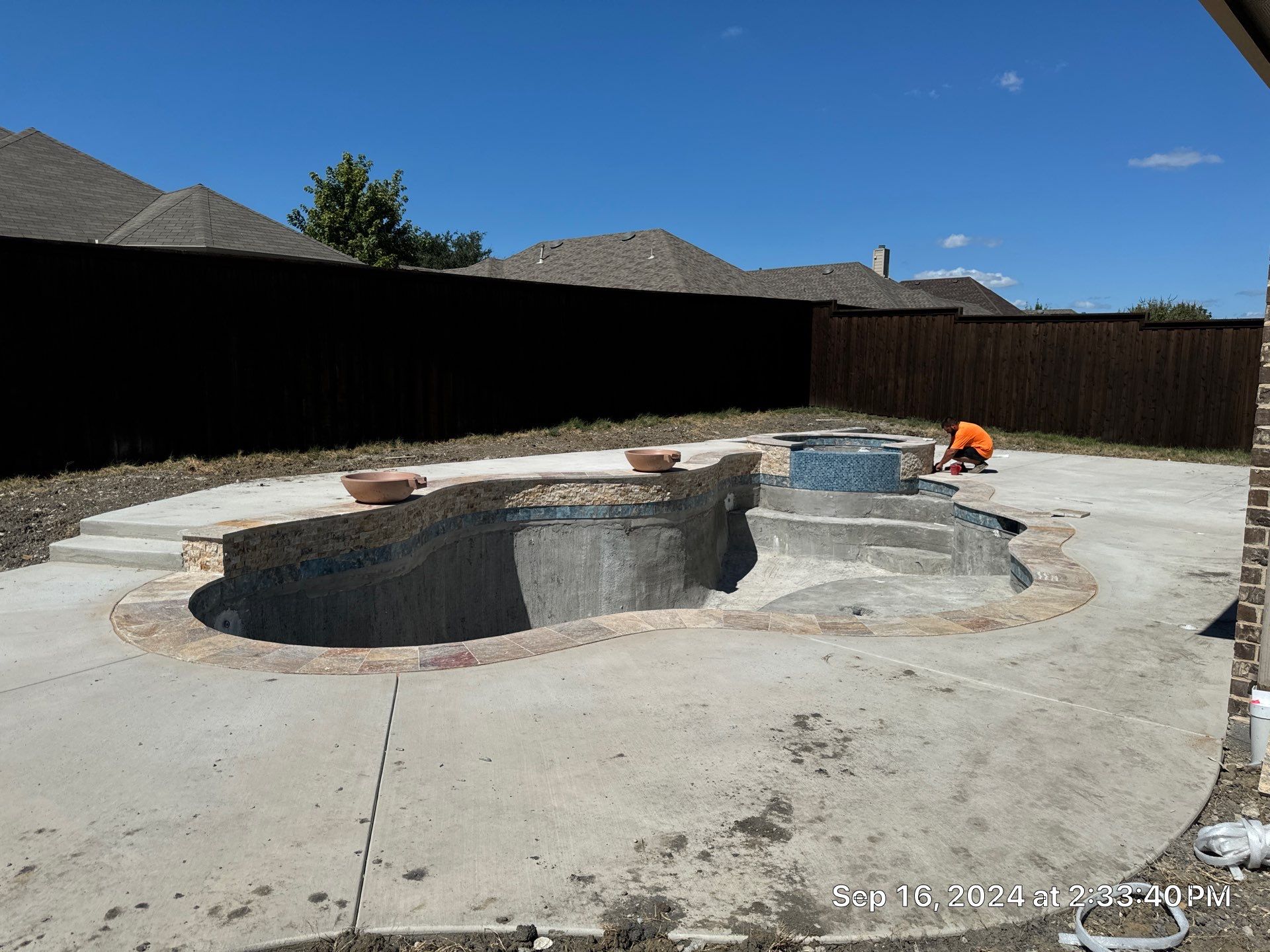 Freeform Pool with Raised Stone Spa by Pinnacle Pools and Spas - DFW