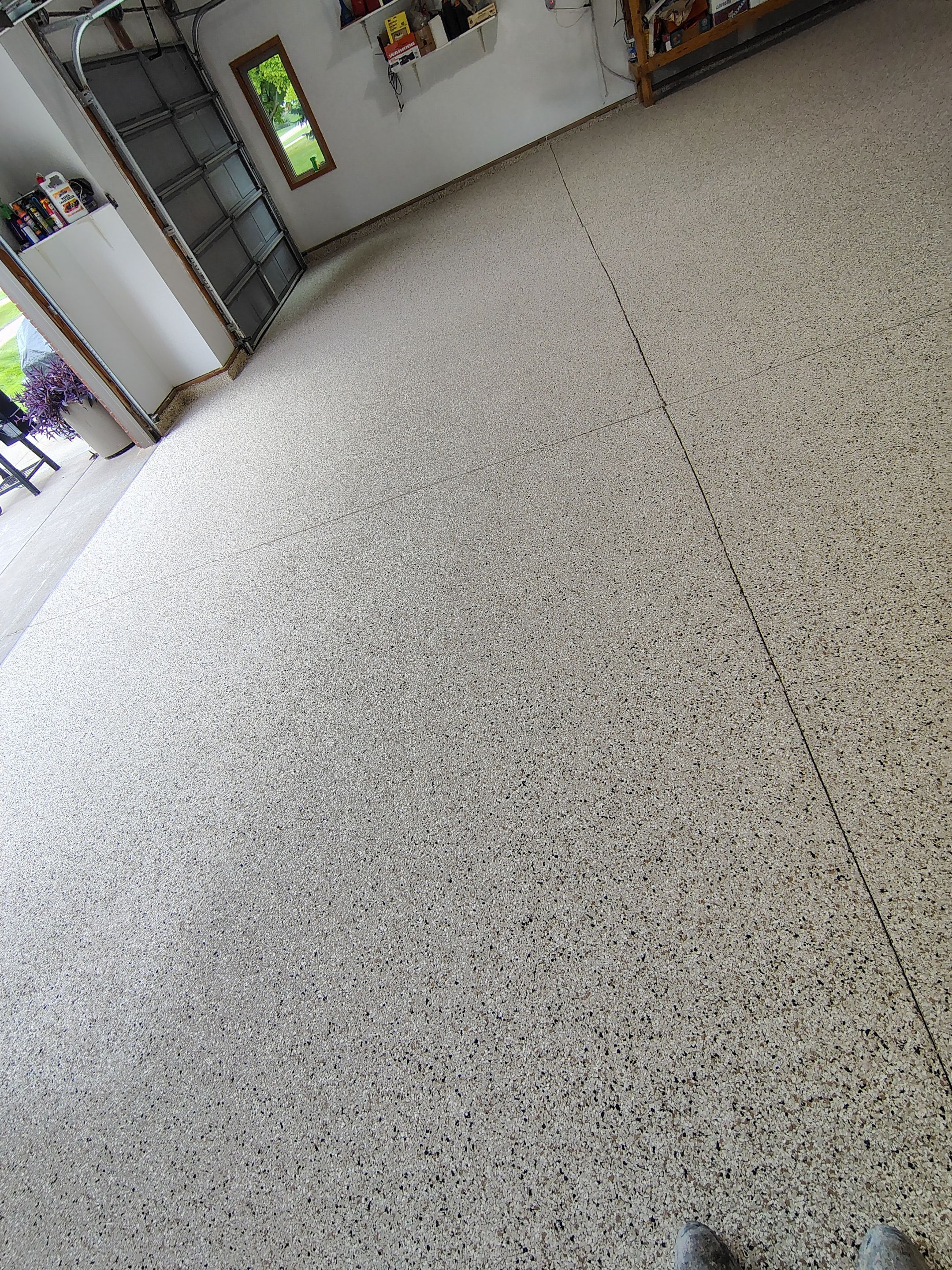 Durable Garage Floor Coating in Brandon by Select Painting, Coatings & Garage Cabinets