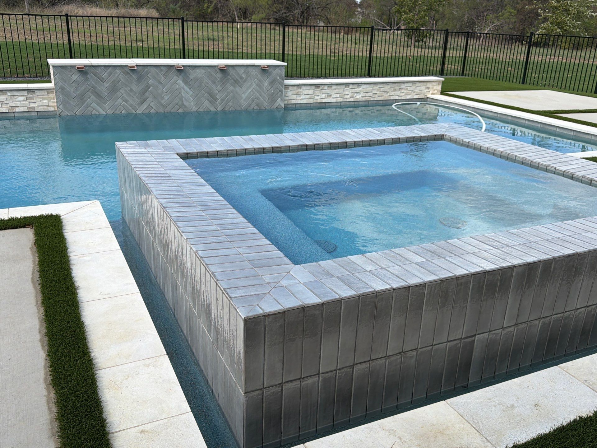 Modern Geometric Pool with Raised Spa and Tanning Ledge by Pinnacle Pools and Spas - DFW