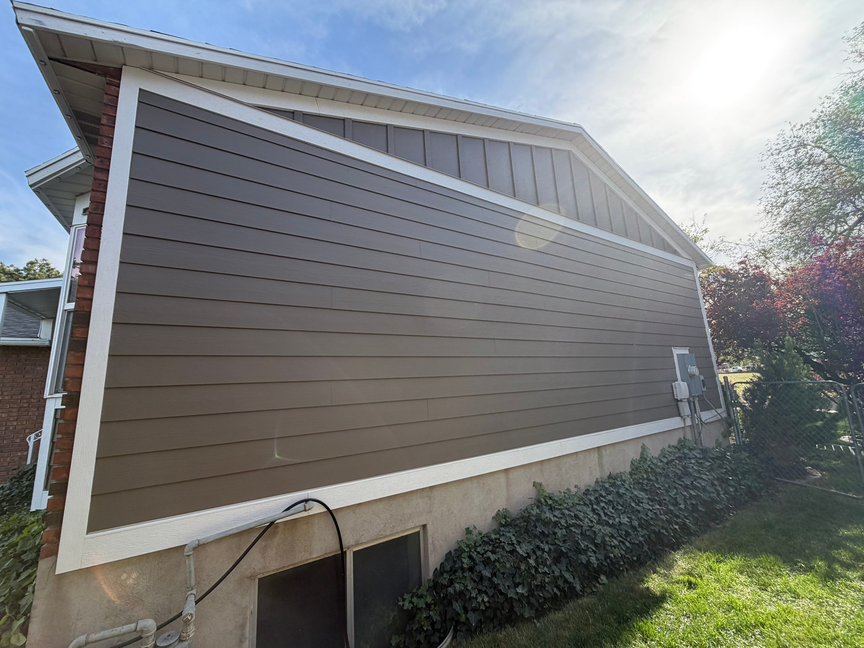 West Valley City | Aluminum to Hardie Conversion | Timber Bark & Arctic White by Ideal Siding Utah