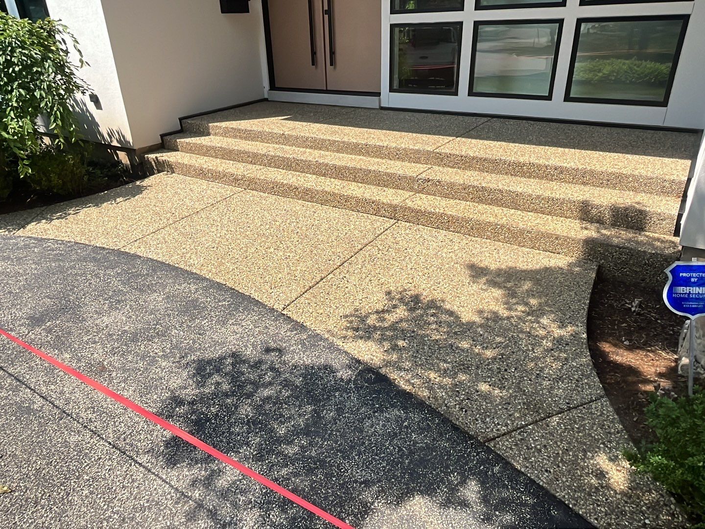 Aggregate concrete cleaning and sealing using Surebond SB-9000 by Northern Power Washing LLC.