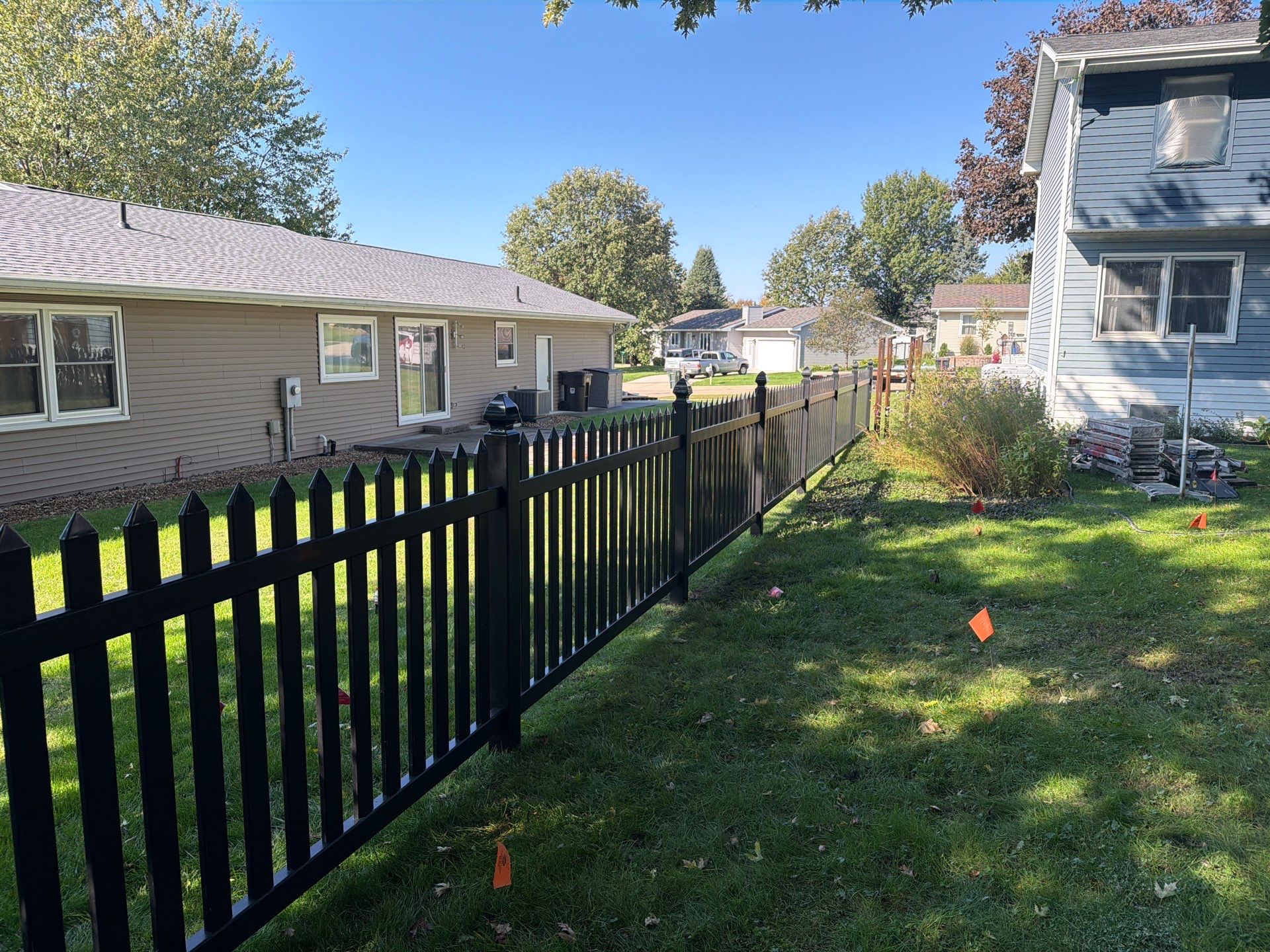 Black Vinyl Spaced Picket Fence Installation in Cedar Falls by Perfect Picket Fence and Stain